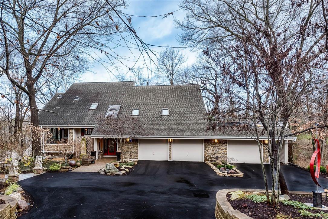 Welcome to the ultimate in peaceful, serene, and sophisticated style. Architectural significance and enduring natural spaces intersect in one of St. Louis’ most spectacular and artistically detailed woodland homes. Time stands still here. Zen is defined here. Natural woods, artisanal tiles, and exquisite stone surfaces provide experiential, organic living at its finest. Nature pours through every glass wall saturating every room, while you sit and soak it in, immersed in every creature comfort imaginable. No detail is missed. African granite, waterfall faucets, and imported antique Chinese cabinetry throughout. In this house comfort is the common denominator. Purposeful style and design choices perfectly complement each bedroom, bathroom, reading space, and living room… all the while celebrating its natural surroundings. This house transcends bedrooms and baths, kitchens and fireplaces.  This house… must be seen to be believed.  In this house, your stage is set for a life well lived.