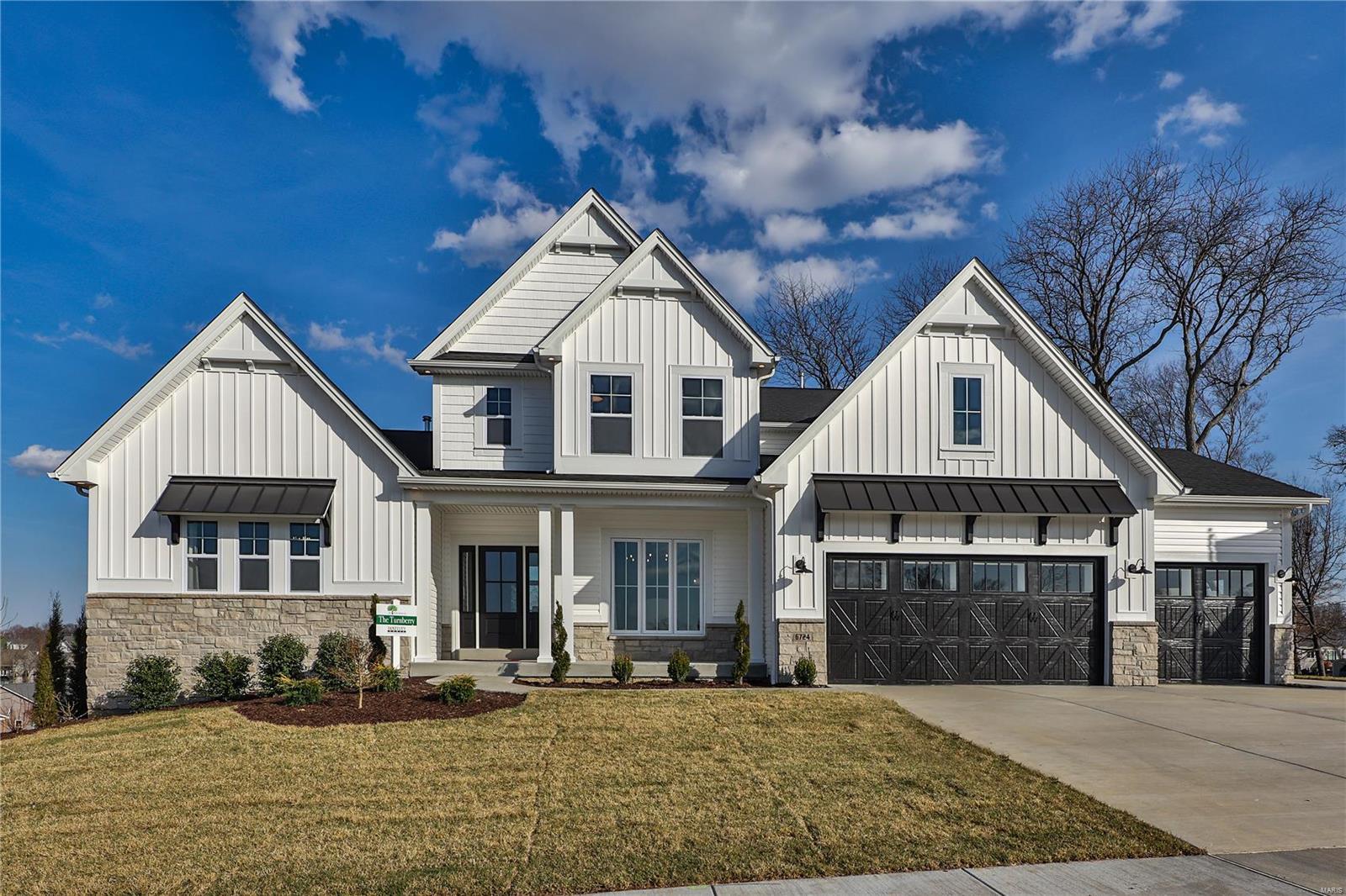 MOVE-IN READY NOW FOR SALE - THE PRESERVE ESTATES DISPLAY 
Discover unmatched luxury and craftsmanship in this stunning 1.5-story McKelvey Homes display, offering over 4,000 square feet of thoughtfully designed living space. Every detail of this home reflects McKelvey’s signature blend of modern innovative floor plans and quality Craftsmanship. Step inside to an open, light-filled floor plan that welcomes you with soaring ceilings, designer finishes, and a seamless flow perfect for both entertaining and everyday living. The gourmet kitchen is a chef’s dream - complete with quartz countertops, built-in high-end appliances, a gas cooktop, and a convenient butler’s pantry that elevates both form and function. Gather in the hearth room, where a 42” gas fireplace with a striking stone surround creates the perfect focal point for cozy evenings. Just beyond, the great room impresses with an 11-foot ceiling and a stunning floor-to-ceiling window wall, flooding the space with natural light and framing beautiful views of the outdoors. The luxurious owner’s suite then offers a private escape featuring 14-foot vaulted ceilings and a spa-inspired bathroom that rivals any resort. Upstairs, thoughtfully designed Jack and Jill bedrooms ensure comfort and convenience for family or guests. A spacious bonus room adds even more flexibility-perfect as a media space, game room, or lounge-and includes a dry bar with a built-in refrigerator, making it ideal for entertaining or relaxing in style. Step outside to a 16x14 covered porch overlooking the beautifully landscaped yard—an ideal setting for morning coffee or sunset gatherings. With energy-efficient Pella windows and McKelvey’s superior construction quality, this home delivers lasting comfort and value. Located in The Preserve Estates, one of South County’s most sought-after communities, you’ll enjoy the perfect balance of peaceful surroundings and modern convenience. If you’ve been searching for a home that makes a statement, this is it. Don’t miss your chance to own this move-in ready McKelvey display home, schedule your private tour today and experience why life is better at The Preserve Estates.