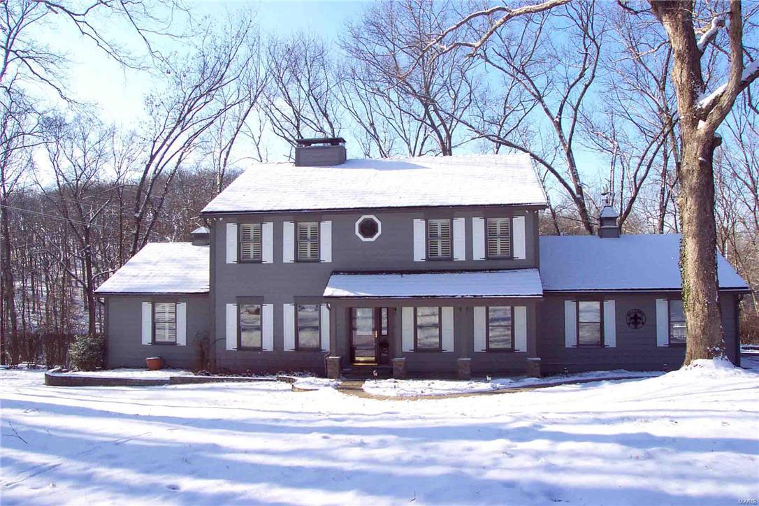 Potential Horse property! Exceptional 2-story in Wildwood situated on over 5 Private Wooded acres. 2C attached Garage and an oversized 1C detached Garage. Large Deck & multiple Patios for entertaining. Home features Hardwood floors, newer Carpet, special Millwork, Plantation shutters, 6 panel doors, Central Vac, 2 heat pumps, zoned HVAC. Updated Kitchen boasts Granite counters, solid wood Cabinetry, Brkfst Bar, smooth Cooktop, built-in Oven & large Pantry. Spacious Great Rm has a woodburning stove, Living Rm w/woodburning frpl, formal Dining Rm, 16x14 3-Season Rm, Main floor Laundry. Master Bdrm Ste with separate Den, walk-in closet, Brazilian Cherry Wood floor, updated Bath w/dbl sink vanity & tiled walk-in shower. The Walk-out Lower Level includes a large Rec Rm with woodburning stove and storage/workshop. Newer septic tank & well pump. Just minutes from all that Wildwood has to offer. Additional Rooms: Mud Room, Sun Room