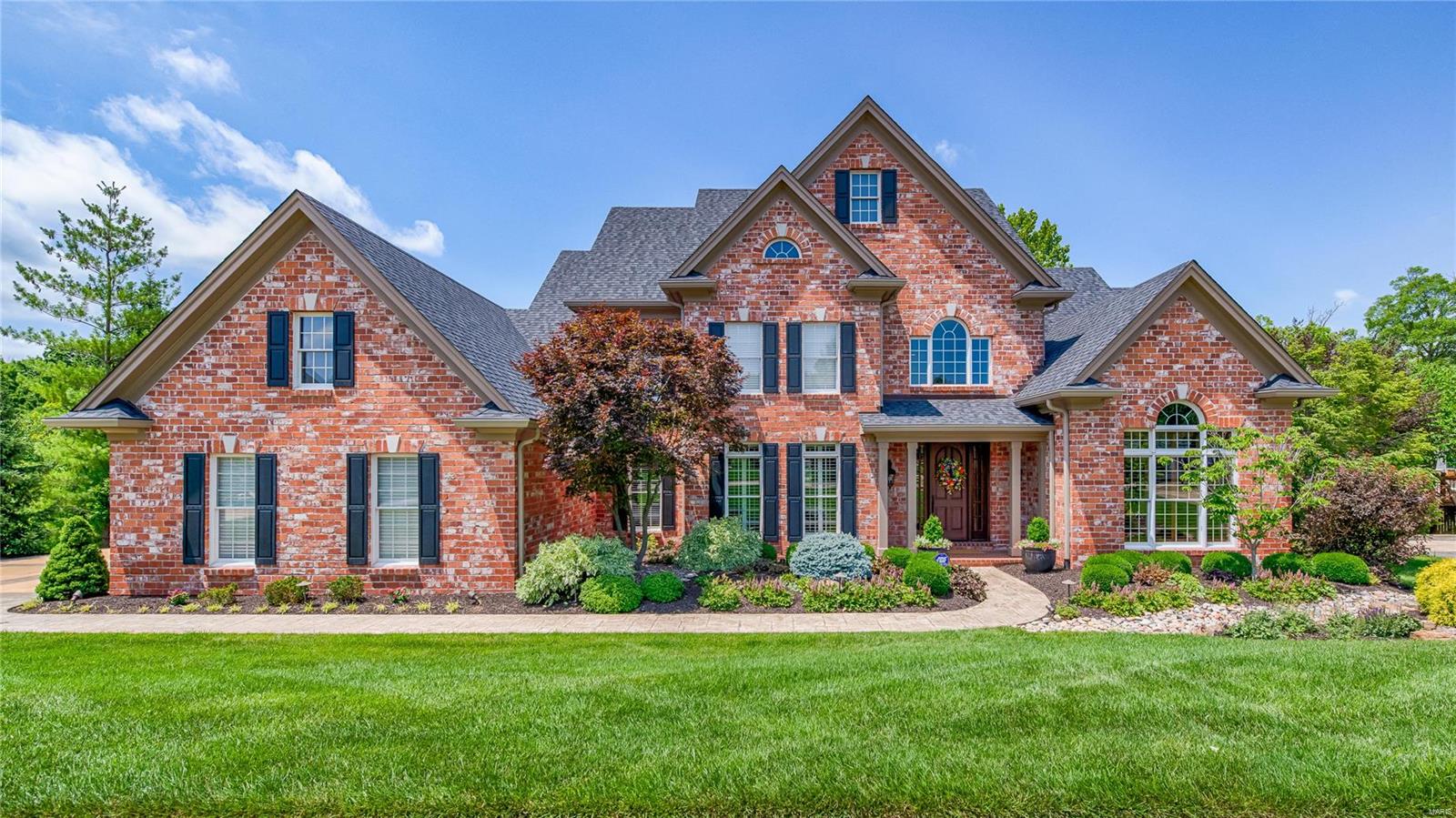 Exquisite updated 1.5 sty custom home on prime lot backing to lake - amazing opportunity!  This home has been extensively updated by current owner w/exceptional quality and taste.  The property offers great curb appeal; 2sty entry hall; gorgeous paneled library w/12' box beam ceiling and fireplace; formal dining room w/fireplace and butler's pantry; large open 2sty great room w/fireplace, wet bar and wall of windows; fabulous new gut/remodeled open kitchen w/large center island, granite counters, gorgeous cabinetry and high-end stainless appliances; wonderful open breakfast room and hearth room with cathedral ceiling and fireplace; main floor laundry, screen porch and master suite with new gut/remodeled master bath; 3 additional bedrooms and 2 remodeled baths on 2nd floor; finished w/o lower level with rec room, 5th bedroom, workout room, bath, 2nd screen porch and amazing wine cellar; exterior patio w/pondless water feature and fire pit; newer roof, siding, HVAC and much much more.