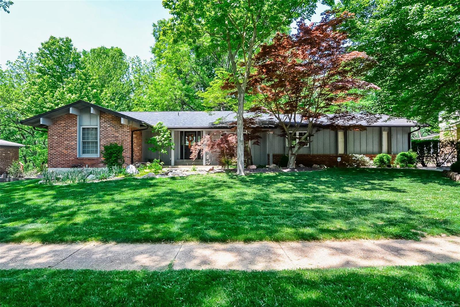 Spacious 3Bd/4Bth(2F/2H) ranch located in sought-after Ladue Park! Open floor plan w/3300+sqft of living space w/finished LL.Step inside the Entry that leads to Dining Rm w/fresh pain t&gorgeous moldings. Updated Kitchen w/42" cabinets,granite some newer appliances &adjoining Breakfast Rm w/large window&door to patio. Large light-filled Family Rm boasts built-in cabinets, full masonry FP &gorgeous wood floors. Spacious private Master Ste w/His&Her closets&updated Master Bth. Also find 3add’l Bds, full Bth &convenient Powder Rm on Main Flr. Finished LL w/large Rec Rm wet bar,Sleeping Rm w/cedar closet,Office, Powder Rm&tons of storage. Highlights: paver patio, 2water features, central vac, sprinklers, high-efficiency HVAC &2car garage. Relax outside on patio &enjoy the large yard backing to woods. Great location~close to shops, parks &restaurants - walk to award-winning Green Trails Elementary School! Easy access to Hwys64/40 &141!