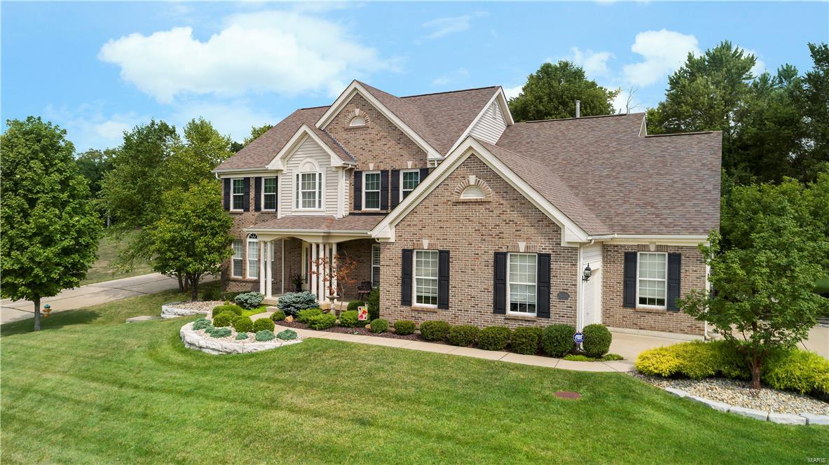 Tapawingo Golf Course Community. Beautifully updated 1.5 story with 4 bedrooms and 4.5 baths. Numerous updates including new luxury master bath in 2017, new roof 2016, beautiful new hardwood flooring on main level in 2016, new hot water heaters in 2016, new upper level A/C in 2015 and newer granite counter tops and stainless appliances in the kitchen. This home also features a finished basement with game room, office, full bath and dry bar. The gourmet kitchen is spacious and perfect for family gatherings. The main floor master features a new bath with dual sinks, vanity, separate tub and shower. The upper level features a bedroom with en suite full bath, an additional 2 bedrooms share a Jack and Jill bath and a loft area. The hearth room has a gas fireplace. The great room is very spacious and comfortable. You'll enjoy formal dinners in the separate dining room. The private lot is  1/2 acre. This beautiful home must be seen to be appreciated! 12 Month AHS warranty included.