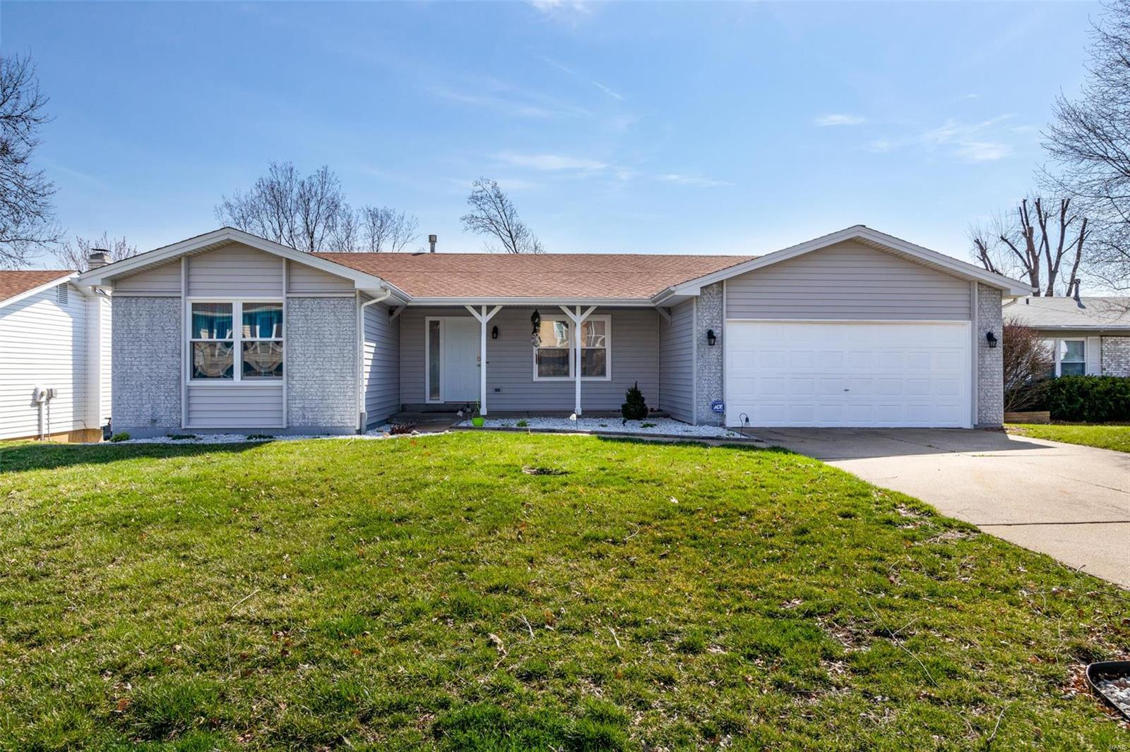 Awesome kitchen, freshly painted cabinets, brand new backsplash, gas stove, pantry, and heavy duty garbage disposal! OPEN floor plan NEW carpeting, New kitchen flooring, new WINDOWS, and new siding! Family room with wood burning fireplace & book shelves. Head out to the back deck & check out the fenced in yard! Both main level baths have nickel fixtures & ceramic flooring! You will love the convenience of having a finished WALK OUT lower level with great room, office-den, sitting room & half bath! Freshly painted interior! Big fenced back yard to enjoy & play! Big covered front porch for enjoying evenings, and the sweet stoned flower beds with perennial plants! Close to hospitals (Mercy 5 min drive), schools, shopping & access to main artery highways to make ANY commute a breeze! Sits back far enough you can forget you're in the middle of suburbia. Make an appointment today to see this Oasis with your very own eyes! But don't wait too long it will be gone before you know it.