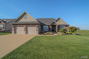 Here's an impressive 3 bedrm, 2 bath home that's loaded with upgrades.  The open floor plan creates a perfect setting for entertainment & relaxation.  The vaulted ceilings, plantation shutters & crown molding are impressive!  In the kitchen, you need to check out the beautiful granite counter tops, tile back splash, stainless appliances, a walk-in pantry, as well as a beautifully upgraded breakfast bar.  The breakfast room opens to an inviting covered patio. For holiday dinners, you'll enjoy the beautiful dining room.  This home has a split bedroom floor plan & the spacious master bedrm suite has a luxury bath with his & her vanities, and a separate tub & shower. Other highlights include a roomy main floor laundry, professional landscaping in the front yard, as well as a back yard that backs up to a field for privacy! Seller is also offering an AHS Home Warranty.