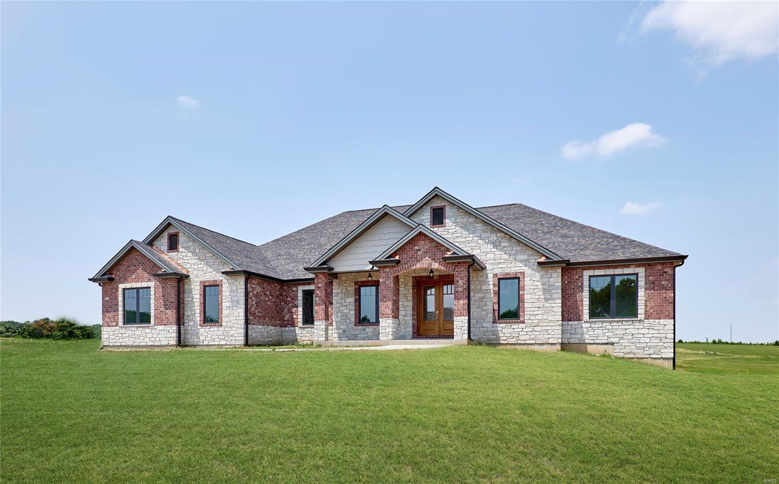 Brand new elegant custom ranch home on a 3 acre lot in Kohler Estates Subdivision just waiting for you to occupy. This home with over 5400 square feet of living space includes, 6 bedrooms 5 full baths, a gourmet kitchen complete with custom cabinetry and complete appliance package, a large great room with brick and stone gas fireplace. This home has 10 and 12 foot high ceilings on the main floor with custom mill work, a large covered rear porch with wood ceilings, 8 foot tall interior doors, Anderson windows and much more. A large finished walk out lower level complete with 9 foot ceilings, a custom wet bar, another bedroom and full bath, large rec room and separate work out room or media room. Dual zone heating and cooling and dual tankless water heaters included in this exquisitely constructed home. Convenient location just minutes from Lake St. Louis and Augusta Wine Country! Additional Rooms: Mud Room