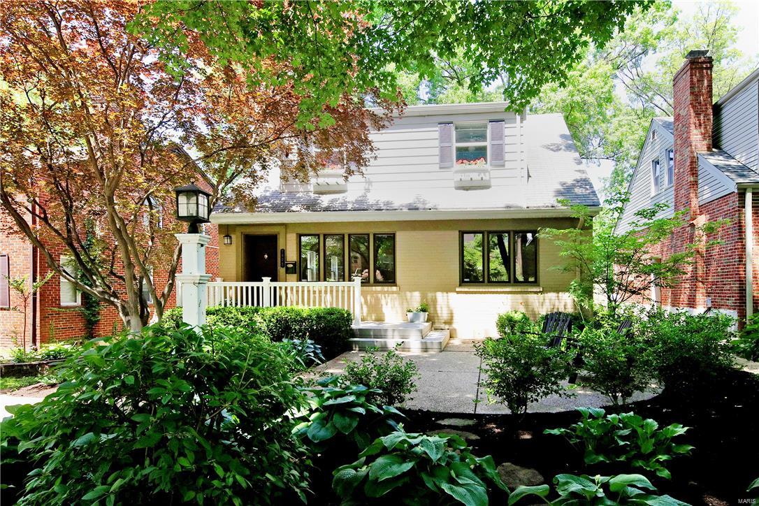 Charming cottage-style four bedroom, four bath University City home with fantastic open floor plan and 2700+sqft provides perfect living for today's lifestyle.  The Main Level offers large Living Room with fireplace, separate Dining Room, fabulous light-filled Family Room with vaulted ceiling opening to an updated Kitchen with maple cabinets, center island, planning desk, and Breakfast Area. Bedroom/Office and full updated bath complete this level. The Second Floor boasts a large Master Bedroom Suite with updated bath and walk-in closet, 2 additional Bedrooms and hall bath.  Finished walk-out Lower Level with Recreation Room, Workout Room, newly finished half bath, laundry, tons of storage and access to tandem garage. Fenced yard, large deck overlooking beautiful landscaped yard.  Walk out your front door and stroll to downtown Clayton, Delmar Loop, Award winning Forest Park, restaurants and shops or relax on your front patio with a good book. Put this on your MUST SEE list!