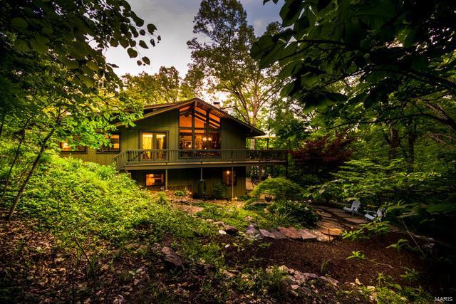 Here, you can unwind in total seclusion at the end of a long day, or bask in sights and sounds of nature while enjoying your morning coffee*Take your pick of places to relax outdoors, on one of two patios or wrap-around deck*Inside, it's spacious & light-filled with walls of low-E windows & doors on both floors overlooking the peaceful & private 3+ acre wooded lot*An entertainers dream or perfect family home*mostly wood flooring throughout, vaulted ceilings, bookcases, brick floor to ceiling fireplace separating the great-room & dining room*An efficient Asian feel kitchen features soapstone countertops, smooth glass cooktop, convection ovens & cabinets w/milk glass inserts adjacent to a cozy den leading to your very own Zen garden*Lush w/native wildflowers, trees & stone, it's tucked away yet only a short distance to schools, dining, shopping, movies, YMCA, Rockwood Reservation & hiking trails*Regroup & recharge before heading out again; you're going to want to call this home.