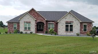 Welcome home to this gorgeous 5 bed/3.5 bath home located in Greystone Rdg in Jackson. Home sits on 2.31 acres, Open Concept with custom kitchen with beautiful granite counter tops, large island, SS appliances, walk-in pantry, office area, formal dining room, large main level laundry w/ sink and cabinetry, huge living room with vaulted ceilings and gas fireplace, Master suite & bath with dbl vanities, custom tile shower w/ dual shower heads and walk-in closet. Walkout basement with 2 additional bedrooms, full bath and large family room with wet bar.  Tons of storage w/ 4th garage/John Deere room.  Home has a salt free water softener, reverse osmosis Walter filter and whole house water filter system. Professional  landscaping and the brick is something you won’t see anywhere else...custom design by seller. The massive half covered/half open deck is where you will want to spend a lot of time over looking the pond. Jackson school district..Easy access to I-55..close to Cape or Jackson