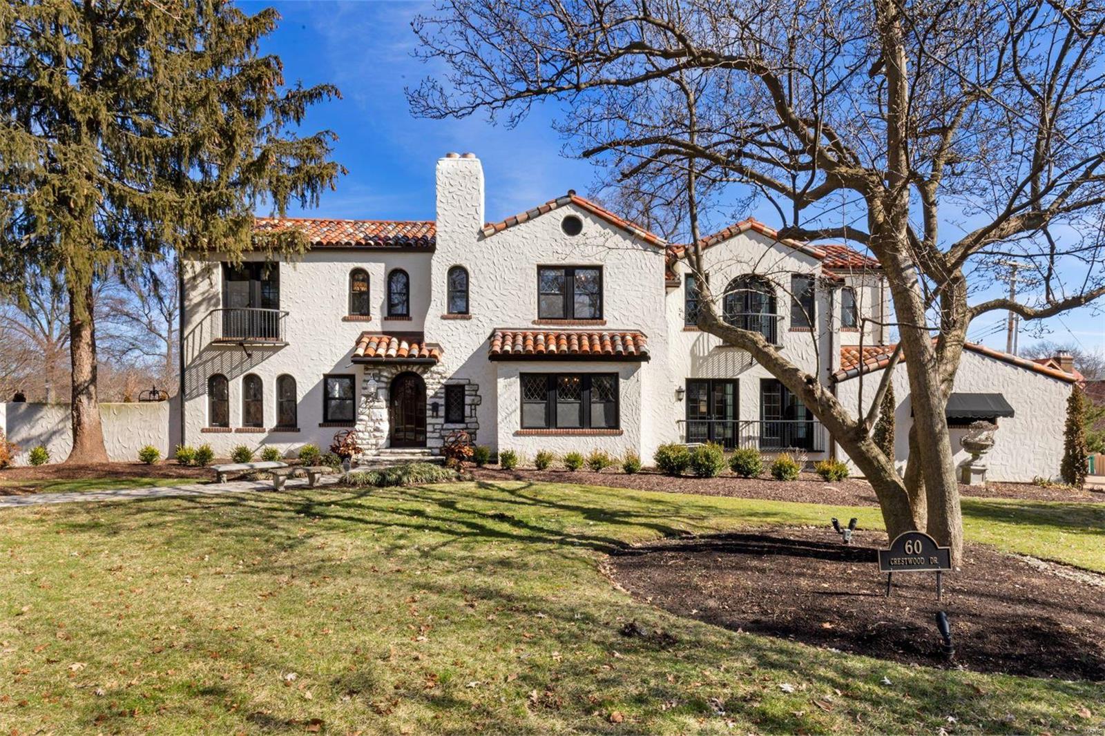 A one of a kind Mediterranean style home sits on a beautiful corner lot in Claverach Park. Meticulously maintained, a combination of history, charm, and elegance highlight this home. Terrazzo floors adorn the entryway, dining room, and living room, offering a glamorous backdrop for you & your guests. Relax on the second-floor balcony and admire the view of the great room with vaulted wood-beamed ceiling, bay of leaded glass windows, and spectacular limestone fireplace. Unparalleled craftsmanship is evident through the oak leaf & acorn medallions lining the dining room ceiling. Natural light floods an expansive, updated kitchen overlooking the pool & covered patio. Spacious master suite features large custom walk-in closet, plus a marble-lined ensuite bath with jetted tub, separate shower, double sinks, and heated floors. 2nd-floor laundry. Main floor bedroom suite perfect for guests or in-law quarters. Heated floors in mud room and first floor bathroom. A magnificent home awaits you.