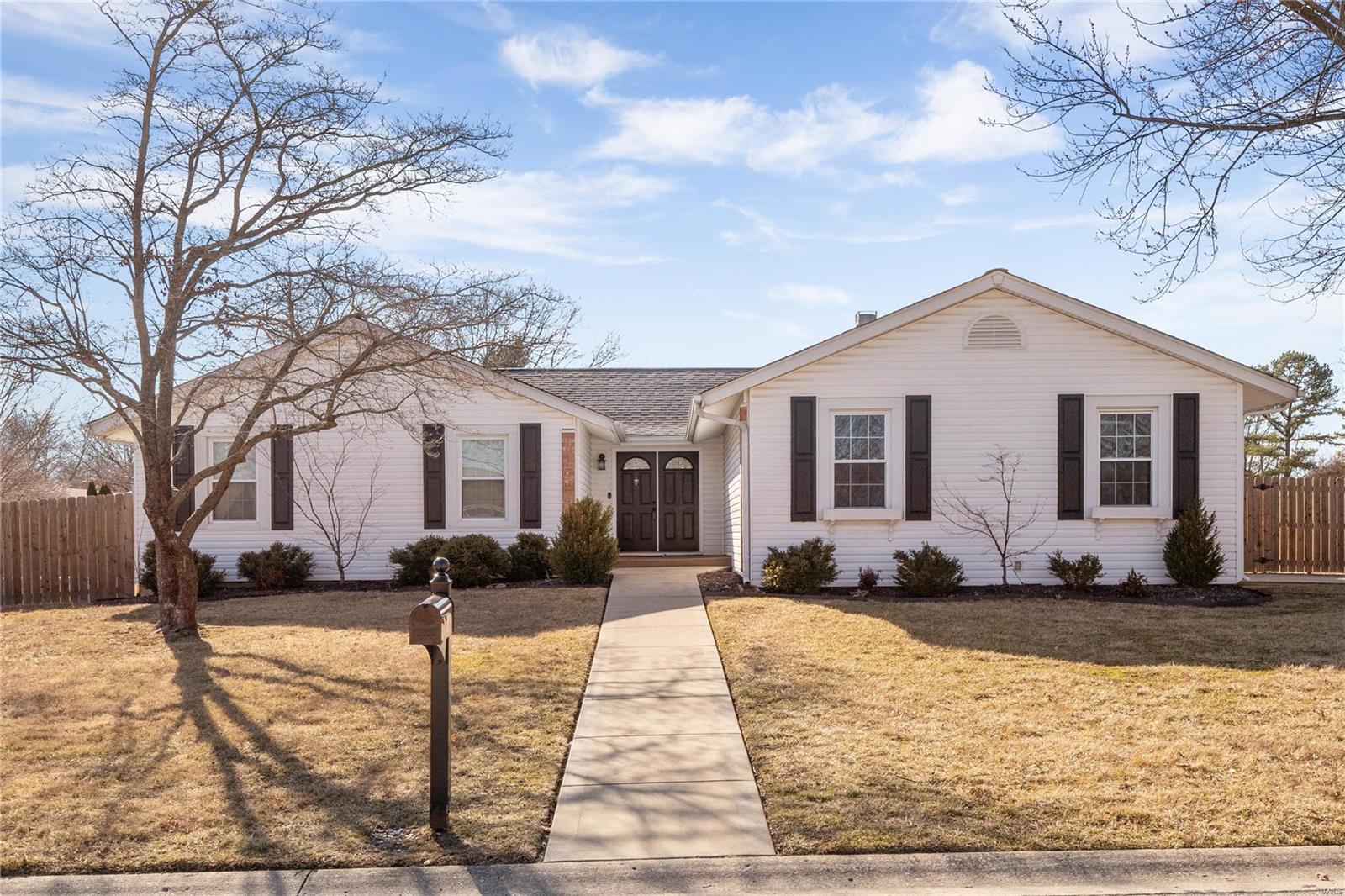 Welcome to 1 Old Hickory Trail! This charming ranch home boasts 3 beds, 2 baths, & nearly 1,500 sqft, w additional finished space in the LL. Step into the inviting living room, featuring a wood burning fireplace, hardwood floors, vaulted ceilings, & abundant natural light. The spacious kitchen, adorned w updated stainless-steel appliances accommodates formal dining. The master suite is a retreat with patio access, a walk-in closet, & a double-sink full bathroom. 2 more beds & another full bath complete the main level. Descend to the LL, where a bonus living room & a versatile sleeping room w a closet await. This meticulously maintained home offers ample space for family & guests. Plenty of room to enjoy the outdoors w this 1/3 ac level lot complete w a privacy fence & the added luxury of a hot tub! Family friendly neighborhood in the Francis Howell school district. Recent updates include a new roof & fence (2020), along w fresh carpet everywhere & paint in the lower level (2024).