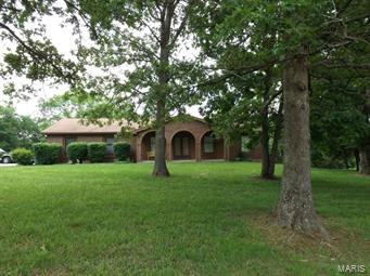 HERE'S YOUR CHANCE TO HAVE NATURE FOR YOUR NEIGHBOR!!  Home backs up to Shaw Nature Reserve.  Brick and cedar home on 2+ acres has big rooms and lots of nice features.  Double sided fireplace between living room and family room, skylights, dining room AND breakfast area, supersized  open kitchen that is offset by a big utility room.  This is a one owner custom built home.  Big deck covers entire back of home and perfect for sitting out and enjoying the woods. New furnace and air conditioning installed Fall, 2014.