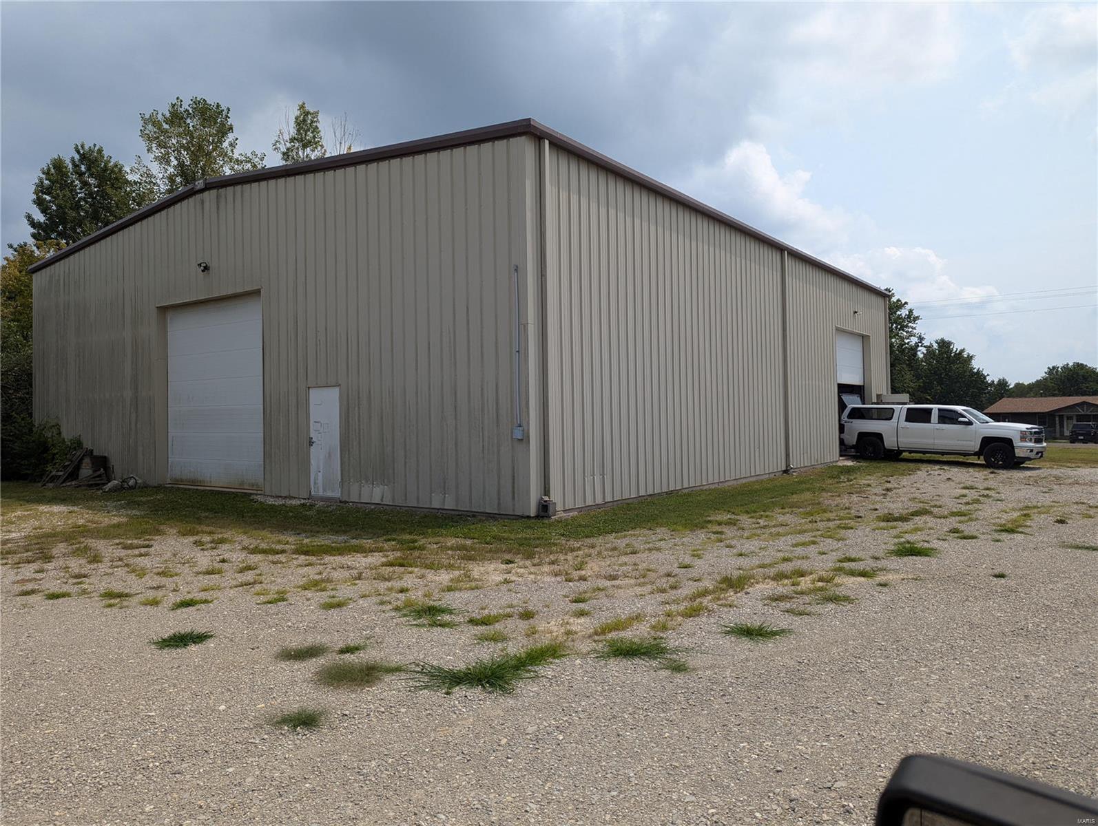 60' x 75' industrial warehouse on 3 acres fronting on paved County highway. 20+' ceiling height, (2) 14' x 14' overhead doors and 2 walk thru doors, 3 phase electric service, full insulated, public water on site, adjoining home and 10 acres may also be available for sale. 

Contact Keith Schneider (314-520-2747) or Joe Schneider (636-578-6069) at Schneider Commercial Partners, LLC (636-949-9797) for complete listing information. Location: Suburban