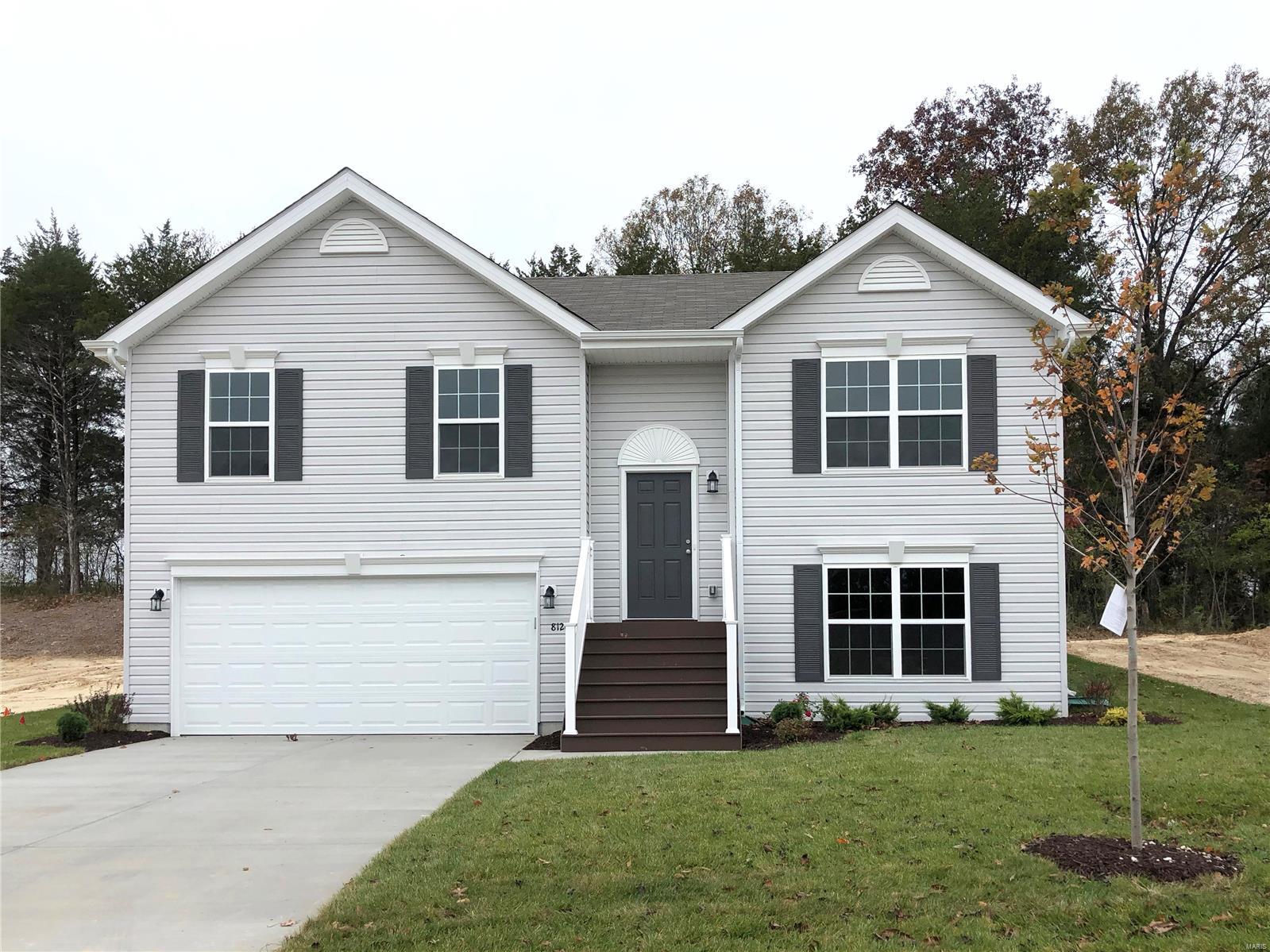 This Birch 3BR 2BA split foyer home will be move-in ready by late summer! Located on a reverse walkout homesite! Exterior features Charcoal Smoke vinyl siding with black shutters and front door. Large eat-in kitchen with center island and breakfast bar, plus spacious living room area. The kitchen features level 4 white 42” tall cabinets and stainless steel GE appliances. Beautiful wood laminate flooring throughout main living areas! Master suite features a walk-in closet plus luxury master bath with walk in shower and high low high double vanity. Home also includes two additional secondary bedrooms and full hall bath. White six panel interior doors with satin nickel hardware, upgraded lighting, and more! The lower level includes a sump pump and ¾ bath rough-in for future finish. Enjoy peace of mind with McBride Homes’ 10 year builders warranty and incredible customer service! O'Brien Place is conveniently located right off Highway 30 adjacent to Northwest HS. Similar home photos shown.