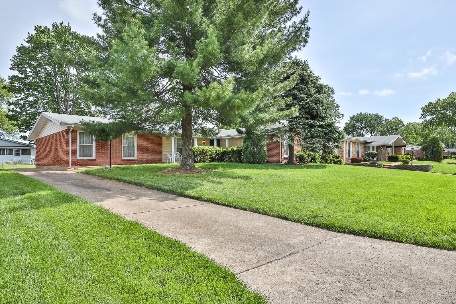 4Bed/2Bath LARGE Ranch situated for easy access to I-270 & Dunegant Park. Amazing home provides ample sized rooms w/some new flooring, large windows that emit an abundance of natural light & generous closets for maximum storage. Family Room exhibits ceiling fan, shelving, brick gas fireplace w/wood mantle & 8 ft. sliding glass door that exits to a covered Patio. Eat-in Kitchen proclaims an overhead light, lighted ceiling fan, solid counter tops, profusion of cabinet storage, ceramic tile back splash, two windows, oversized Pantry, dual sink w/disposal & egress to the Garage, Patio & Lower Level. Appliances include electric cook top, microwave, wall oven w/convection & dishwasher. Master Bedroom Suite flaunts a lighted ceiling fan & walk-in closet. Master Bath displays an extended vanity, ceramic tile back splash, mirrored medicine cabinet & shower w/multi-functional shower head. Expansive Lower Level features a Rec Room w/built-in shelving & roomy Storage Area w/Laundry Hook-up