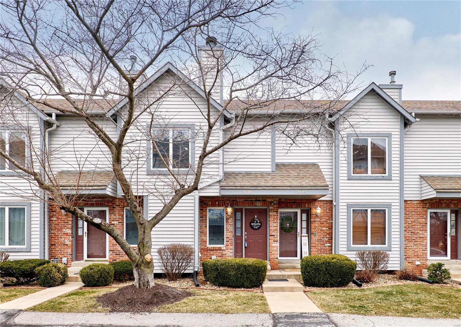 This charming & well-maintained 2-BDR townhouse offers the perfect blend of comfort & convenience. Ideally located w/ easy access to Hwy 70 & 364, you’ll love the hassle-free lifestyle w/ no yard work to worry about! Enjoy exclusive access to the community clubhouse along w/ a sparkling pool & tennis court for recreation & fitness. Inside, you'll find a bright, inviting space featuring a spacious living room w/ a cozy WB fireplace, a wet bar, & a dining area that opens to a private deck through elegant atrium doors. The kitchen boasts a garden window, breakfast bar, & pantry for added convenience. Upstairs, the large primary suite is a true retreat w/ a charming bay window seat & two walk-in closets. The 2nd BDR also offers a walk-in closet & a full en-suite bath. Ceiling fans in both bedrooms ensure year-round comfort. Additional perks include a 2 car garage & storage room in the basement. Don't miss this opportunity to own a stylish, low-maintenance townhome in a fantastic location!