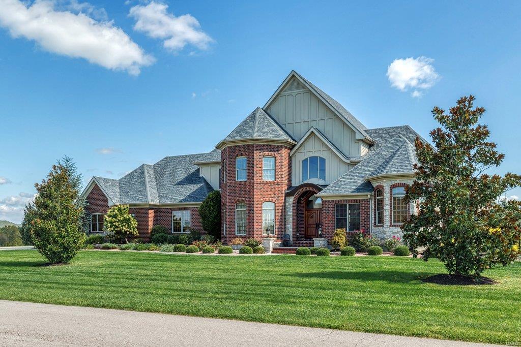 One of a kind newer construction custom luxury home on 3 acres + of resort like setting. Approx 7100 sq ft home has room for everyone & everything. Walk in through fabulous hand-crafted double doors,get ready to be wowed! Inside find exquisite custom millwork extensive crown molding, coffered ceilings,arched openings. Great room w/floor to ceiling windows panoramic views. STUNNING CHEF'S KITCHEN w/2 dishwashers,oversized island w/prep sink, massive breakfast bar,large breakfast area,Viking appliances & custom pantry. Owner suite opens to exquisite luxury bath w/dual vanities. 2 walk-in closets.Custom curved staircase leads to upper level with 3 beds/2 bths. Lower level,entertainer's paradise,w/5th bed w/full bath. Pool table, shuffle ball,work out area. Oversized 3 car garage. Walk out to custom pool w/waterfall. Outdoor kitchen, w/2 gas grills.  Professional landscaping, fencing,Irrigation system,3 zone HVAC &  more. Close to I44 & 270, ROCKWOOD Schools ,golf cart ride to 3 courses.