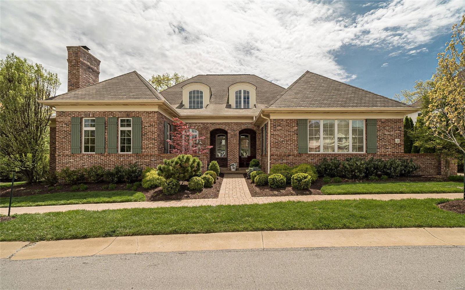 Elegant yet casual, this 1.5 story custom display home with 4 bedrooms, 4.5 baths combines the finest design and details to create a luxury home perfect for the buyer looking to simplify life but who still wants the space to entertain. Lovely entry with exquisite iron staircase leads to wood-paneled study with FP and the master suite wing with two terraces, sitting room and luxury bath. Gracious LR with terrace and FP, chic DR and wet bar with wine cooler takes you to the fabulous open gourmet kitchen, breakfast and hearth room with Pella French doors to another terrace.  Upstairs are two ensuite bedrooms with study niche. The lower level has 4th bedroom, full bath, exercise room, family room with kitchenette and tons of storage. Sunny main floor laundry with built in desk and cubbies, elevator to all 3 levels, oversized 3 car garage, 9’and 10’ ceilings and beautiful landscaped yard maintained by HOA.  Ladue Schools. Walk to MICDS. Carefee, luxury living. Truly one of a kind property. Additional Rooms: Mud Room
