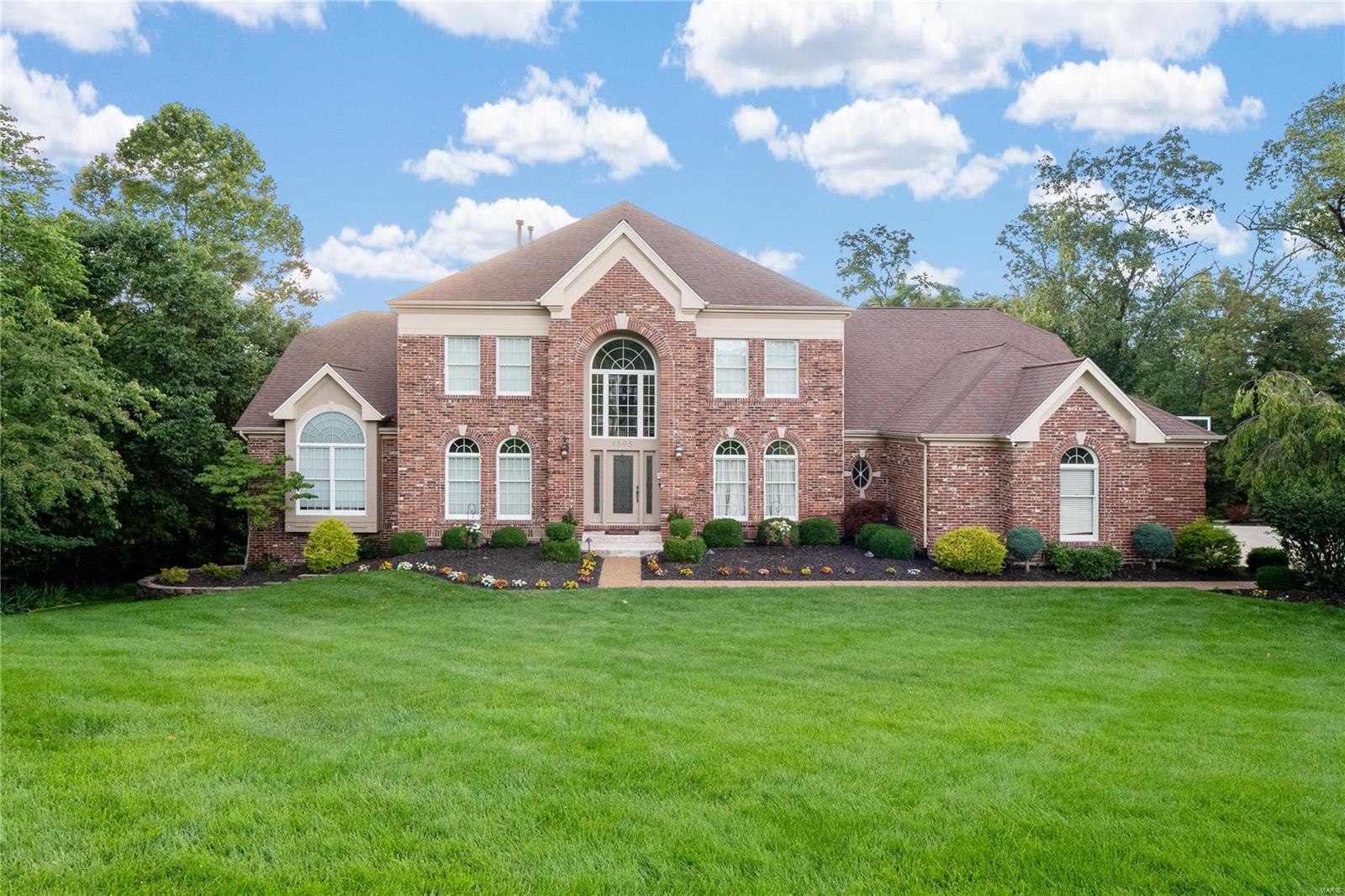 Exceptional 1.5-story home on a 1-acre private cul-de-sac lot. Features include an inground pool, covered patio, and firepit. Extensively updated throughout. Front and rear staircases, spacious dining room, and office/living room. 2-story great room with stone fireplace. Updated kitchen with custom cabinets, breakfast bar, double ovens, and warming drawer. Custom tile backsplash, butler's pantry, and walk-in pantry. Kitchen opens to large hearth room with vaulted ceiling and stone fireplace. Main floor master suite with luxury updated bath, heated floors, custom shower with multiple heads, and walk-in closet with custom shelving. Upper level features loft area, 3 bedrooms, one with private bath, and a Jack and Jill bathroom. Walkout finished lower level with rec room, gas fireplace, game room with wet bar, exercise/hobby room, large bedroom, and full bath. Lush landscaping, inground sprinkler, 3-car garage, security system, and more!