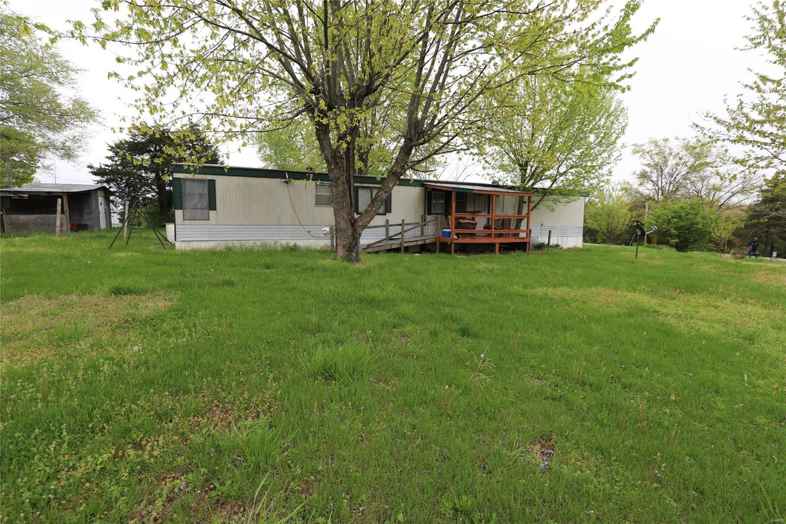 If you are looking for a 3 bedroom one bathroom trailer on a little less than a acre of property youve found a good investment. With some TLC this house can be made a home easily. No showings of the inside will be permitted as the floor has weak spots present.