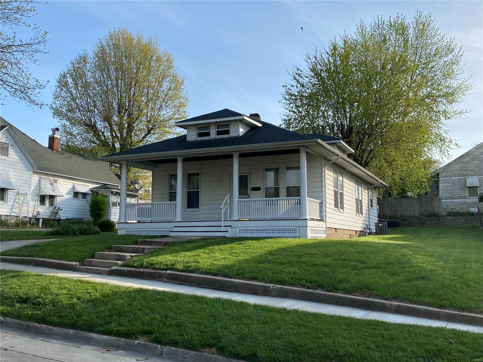 This cute craftsman style bungalow caught my eye many times as I passed by! So much fun to see how owners' character & creativity come out in their design choices. The original, wooden doors/floors/woodwork, unique lights/fans, pipe-style shelving & Boos butcher-block top island provide a great mix of vintage/modern. Bonus attic room w/ dormers has me imagining what the new owners will do with the space. Workout area, play room, craft room, den? Could even be made into a third bedroom! Roof 2019, AC/Washer/Dryer 2015, Dishwasher/Refrigerator/ 2020/2021 Covered front/back porches, raised garden, fire pit, and open patio create nice outdoor spaces. Detached garage w/unfinished second floor (reached by ladder) could be finished for a another bonus space or add'l storage. Located just a short walk to Riverview Park, downtown coffee shop, restaurants, banks, shops, library and riverfront. Sadly the adorable camper doesn't stay. 
Preapproval or proof of funds required to schedule showings. Additional Rooms: Mud Room