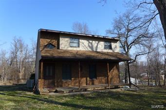 PRICED TO SELL! Cozy home on a very private lot with improvements. Newer roof (2008) and vinyl siding( 2 yrs old.)  Electric furnace is less than one year old (5-2014). Carpet in living room and 2 upstairs bedrooms newer. Above ground pool with deck surround will be a plus this summer. Large lot provides plenty of space and privacy for any family. Main level Master bedroom and bath. Upstairs bedrooms have own bath. At this price you can make more improvements. This is a deal you don't want to miss.  Above ground pool will make your summer special.