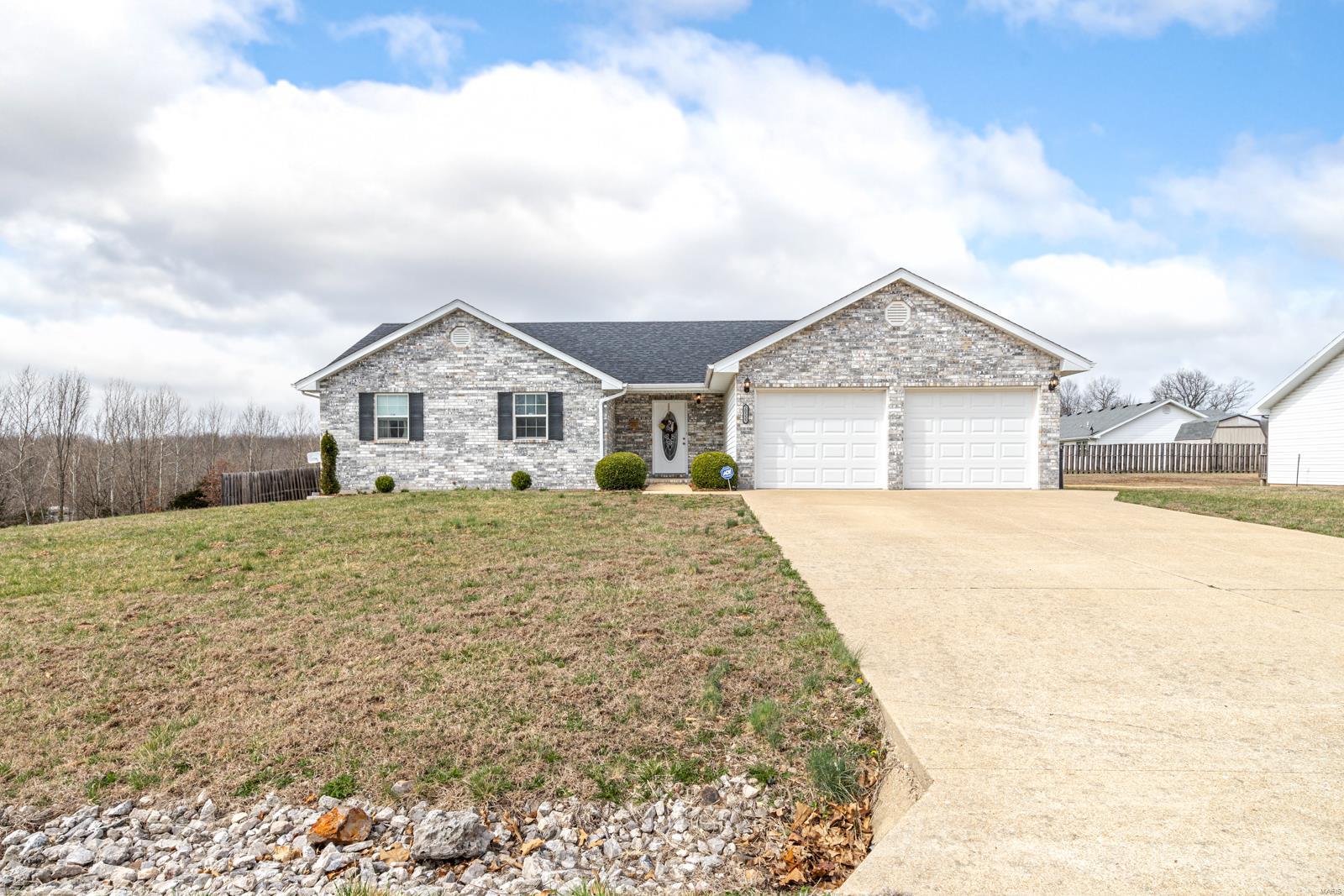 Built in 2007, this 3 bedroom two bathroom located in Northern Heights Subdivision sits on, .36 ac m/l. This beautiful home comes with many high end fixtures and custom lighting. Laminate, ceramic tile, and carpet flooring throughout. Newer HVAC system and open concept floorplan. Covered porch and large deck overlooks fully fenced, level, yard on corner lot. Comes with firepit setup in the back yard as well. Kitchen has custom cabinets, stainless steel appliances, and light streaming inside from large windows. Master has large walk-in closet, double vanity, and shower/tub combo. Schedule a showing today!
