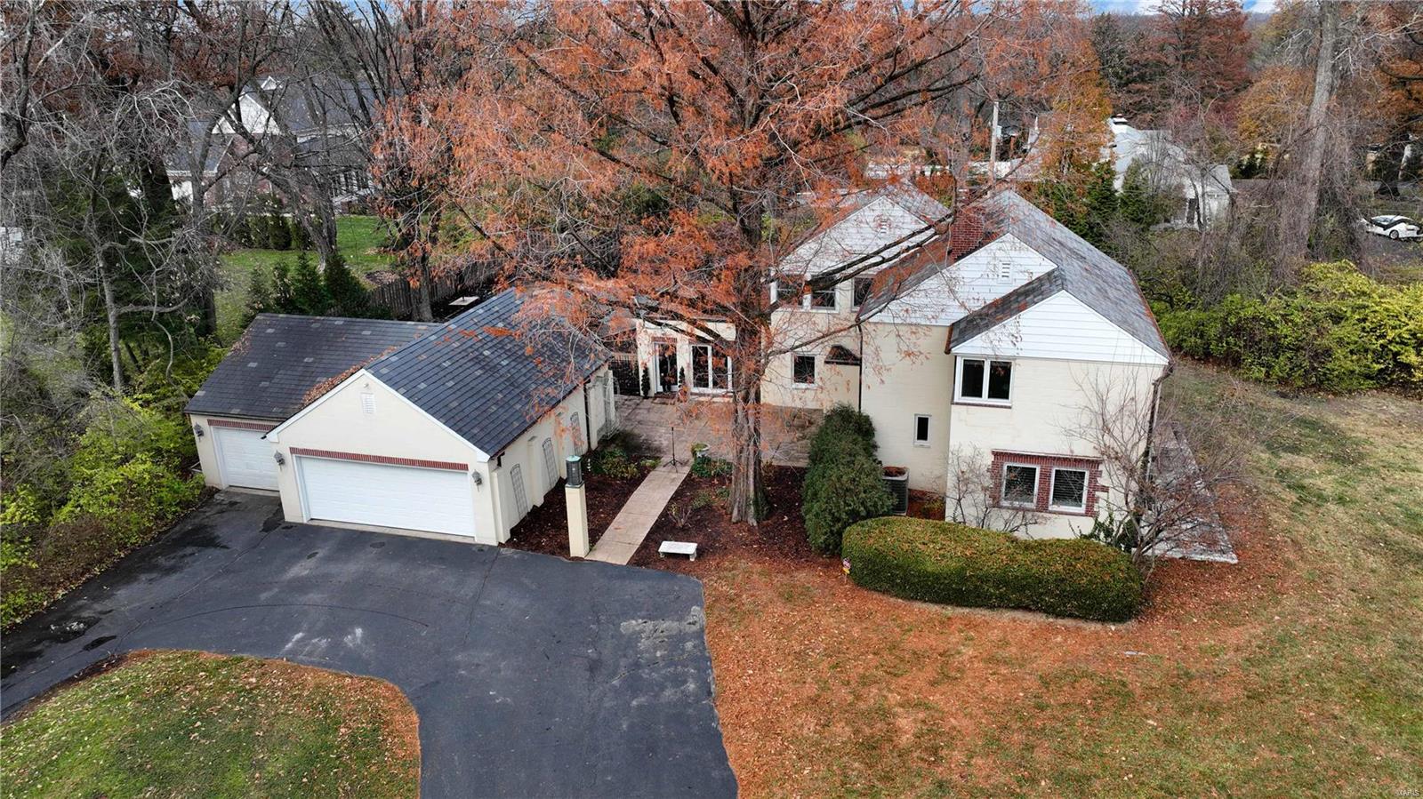 Unique estate setting on 1.5 private acres with circle drive and inground pool in Frontenac.Three bedrooms, two full baths, two half baths, 2,845 sqft and oversized 3-car oversized garage.Courtyard invites guests into living room with floor to ceiling windows, hardwoods floors flowing throughout into updated kitchen w/maple cabinets w/crown, gas range, farmhouse sink, travertine backsplash, quartz counters & butler pantry with wet bar.Dining room opens to office and family room with gas fireplace all overlooking front acreage.Spindled staircase leads to owners suite w/dual closets, updated hall bath, walk-in closet, two additional bedrooms and sunroom.Beautiful landscaping surrounds rectangular swimming pool w/pebble tach along w/side patio & wood burning stone fireplace just off kitchen that is perfect for entertaining.Copper gutters, slate roof, highly rated Ladue School District on 1.5 level acres goes unmatched for this location in Frontenac priced under one million!