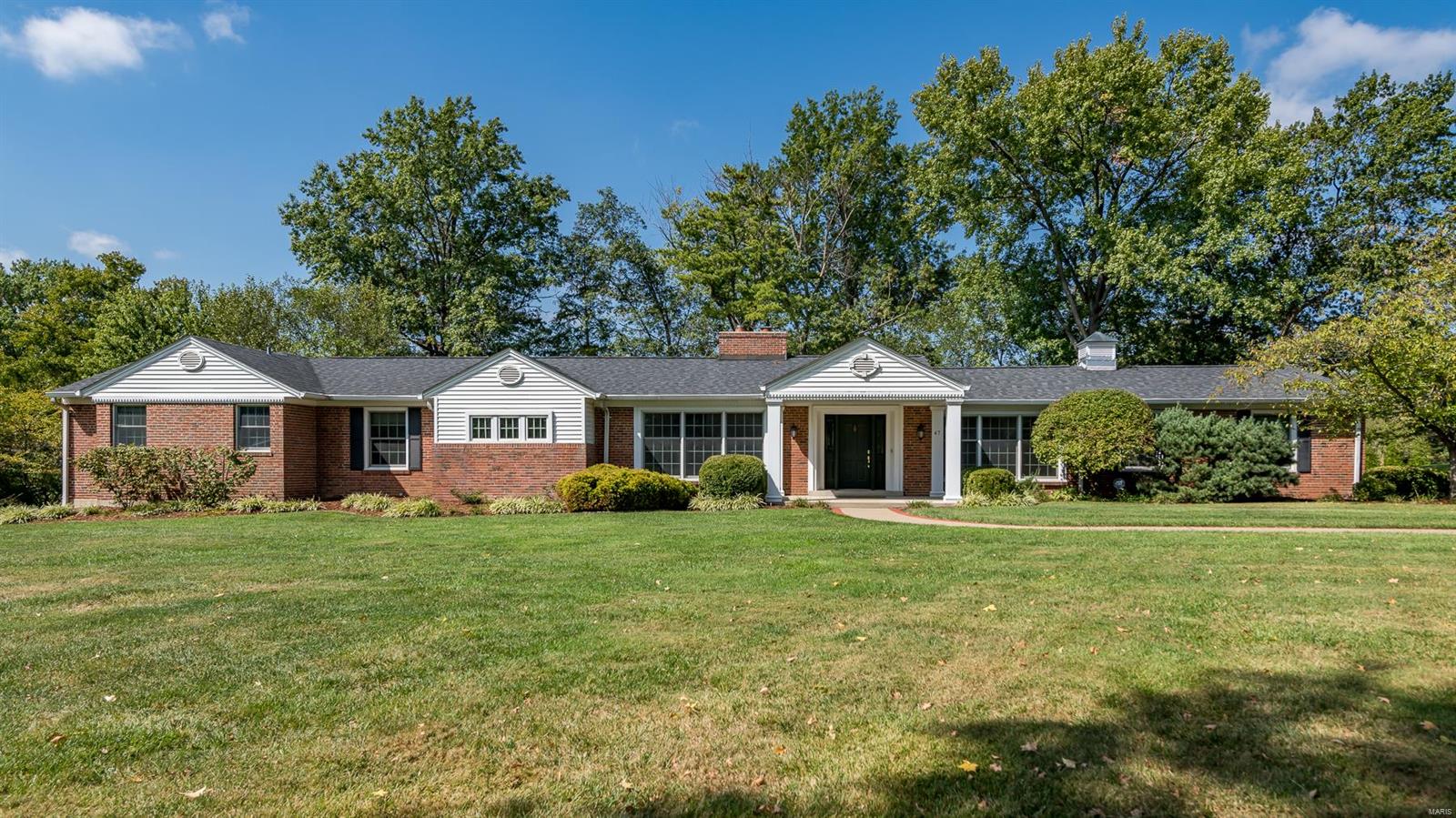 Stunning ranch home, perched on a spacious corner lot within prestigious Ladue Estates. Revel in the grandeur of 4 generously-sized bedrooms and 5 full bathrooms, bathed in natural sunlight throughout. You will be enchanted by the vaulted ceilings, pass-through fireplace, and a gourmet kitchen boasting stainless appliances, center island, and an adjoining breakfast room—a haven for both culinary enthusiasts and entertainers. The kitchen seamlessly transitions to a back patio adorned with a water fountain and fireplace, creating an ideal oasis for outdoor gatherings or peaceful solitude. The primary bedroom is a sanctuary of tranquility, complete with two walk-ins and an opulent bath. LL has additional space for recreation, home office, or customization to suit your lifestyle. Three-car garage, offering ample space for both vehicles and storage, sprinkler system, and fenced yard. Nestled in a prime location, one-story living at its best, close to schools, highways, hospitals, and more. Additional Rooms: Mud Room