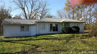 Offers open concept with living room, dining area, family room and kitchen. 3 bedroom, 2 full baths and laundry room on main level. Full basement with central air and forced air gas heat. Well and rural water. Private setting with open ground and woods. Only 1 mile off Hwy. 61 between Palmyra and Quincy. Lots of updates! Palmyra school district. Priced to sell with quick possession. Call to see!