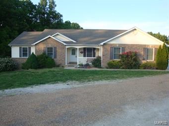 HA868  PARK-LIKE setting for this lovely 1792 SF  4 bdrm, 3 bath home on 4.63 acres. Land is gently sloped and mostly cleared. Back of lot is wooded for privacy. Seller has newly installed carpet in mstr bdrm, fam rm and liv rm. plus vinyl in dining rm and kitchen. Master suite has a full bath with whirlpool tub and WI closet. Lovely kitchen & all appliances stay. Spacious rooms throughout this home. Bay window in din rm. Gas fireplace in family rm with sliding door to 12x20 deck. Gas furnace and C/A. 6 ceiling fans. Part fin FWO basement. Lg family room w/slider to 12x12 patio. Bonus room being used as a bedroom.18x14 Kitchen/rec area. Full bath w/shower. OS 22x26 attached 2 car garage. Detached 20x22 insulated WORKSHOP. It has electric, heater and 100 amp elec which feeds off the house which has 400 amp electric. It also has a 10x22 lean-to. 8x12 garden shed. (Island counter in kitchen is portable and does not stay). This home is located in a lovely subdivision close to I-44.