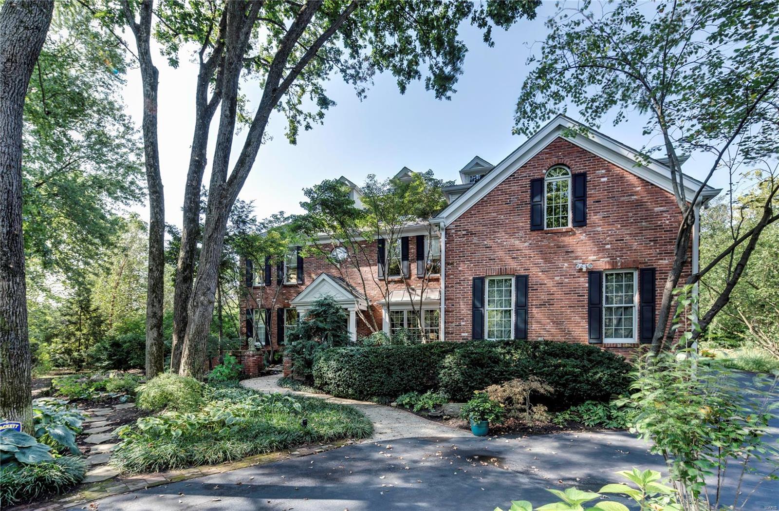 Set in an extremely private space, off a single lane drive, this Ladue home off Conway Road was built by Ellerman to be both functional and efficient. As an offset to any flood plain issues the house was built with no basement and a 3rd floor was added instead, ideal for a gym, studio, office or additional living space with natural light. Convenient to all goods and services Ladue has to offer, including the best schools, both public and private. The home provides an open floor plan and fresh finishes. The main suite enjoys a recently remodeled bath, dual vanities, separate shower and a jet tub. Three additional bedrooms are found on the second level. The eat-in kitchen is outfitted in Viking appliances, granite, and glass front cabinetry. A renovated all-season room provides views of dense private landscaping. The Living Room is two-story, and has the feel of a Colorado lodge. Main level office, garage and laundry. Conway Elementary, Ladue Middle, and Ladue Senior High School.