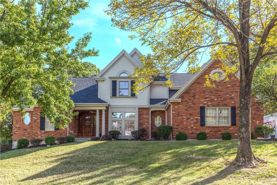 This home is nestled on a 2 acre treed lot and presents a wonderful opportunity for your family to find privacy and live in a great neighborhood. From the first moment you step into the foyer, you'll see all the custom hardwood. The dining room has a step down which makes it stand out and highlights it's millwork. There are transoms, skylights and windows galore. The great room is spacious with a vaulted ceiling, plant shelf, elegant staircase to the second floor and views of the woods thru the wall of windows. The see thru fireplace with gas logs warms both the great room and kitchen breakfast room. The kitchen has double ovens, refrig, Bosch dishwasher, crown mold, kitchen desk, and TV. Lower level offers brand new carpeted large family room, walk-out and full bath. Master bedroom is a true suite with Double French door to step down entry. Trey ceiling, fan and beautiful bath w/ steam shower and walk-in closet. Newer roof, some new painting, some new carpet.