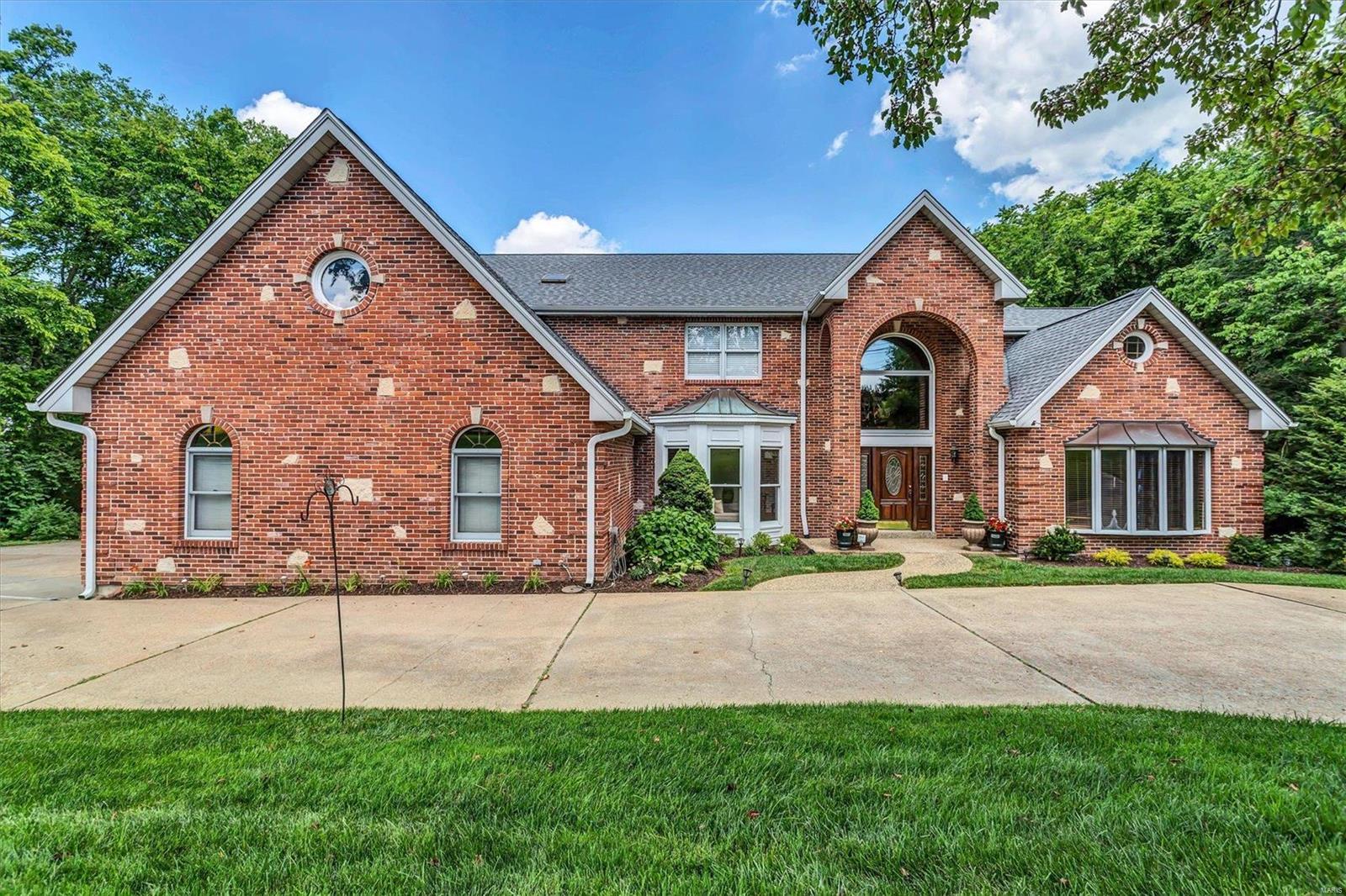 HUGE, 5400+sqft, 1.5-story w/lovely POOL on 1.5 acres in Sunset Hills. 6BR/7BA Oversized throughout. Chef's kitchen w/center serving island/breakfast bar opens to hearth room w/wood burning fireplace. Supersized great room w/2nd full brick fireplace & Palladian windows. Main floor primary ste w/large bath has deep walk-in closet, 2 sinks, shower & separate whirlpool tub. 2nd flr lg BR could be additional primary BR w/full bath & deep walk-in closet. BRs 2 & 3 have Jack-in-Jill bath. 4th BR w/private bath. Main flr office/den. Separate formal dining room. Exceptional millwork & custom wood flooring. Main floor laundry utility room w/sink & closet.  2-story entry foyer. 3-car side garage w/extra pad parking & circle drive. Oversized double-deck leads to nice inground pool surrounded by mature trees w/additional yard space. Walk-out basement has full bath close to pool deck; w/workshop. Outstanding Lindbergh Schools. STL occupancy completed. Across the street from Watson Trail Park. 6/26 Additional Rooms: Mud Room