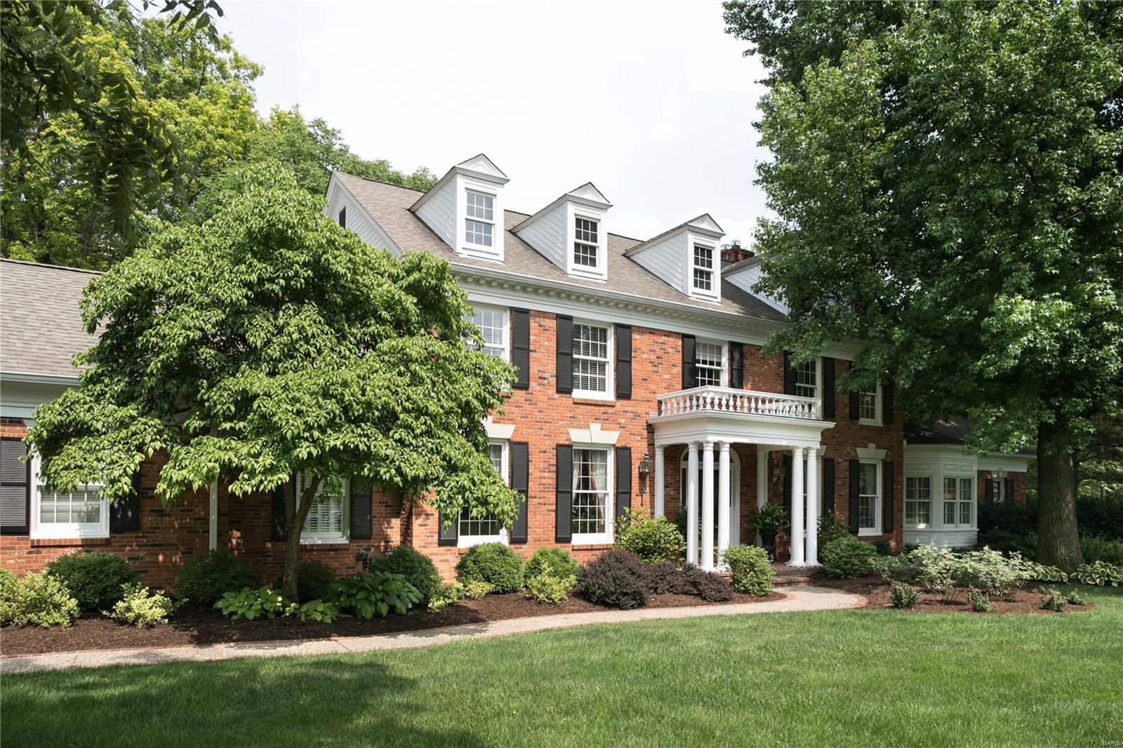 SPECTACULAR NEW LOOK & NEW PRICE! This 5-bedroom home is nestled in a premier gated community in Town and Country. Special features too numerous to mention; highlights include exceptional mill work, 9+ ft ceilings and a lush 1.3-acre lot. The kitchen features stainless appliances, granite counters and lovely adjoining breakfast room. The classic, paneled family room has built-ins, wood burning fireplace, wet bar, and overlooks pool & patio. Main floor master suite features a gas fireplace, large bathroom & walk-in closet. Upstairs, 4 additional bedrooms are spacious and welcoming, with walk-in closets. The finished lower level is made for entertaining, with rec room, half bath & two bonus rooms perfect for media room, workout or additional bedroom space.  With its lovely terraced patio and updated saltwater pool, the professionally landscaped grounds will impress. Large main level laundry/mud room, 3-car garage & Parkway West schools complete this irresistible property.