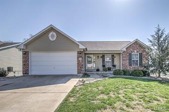This picturesque Festus ranch home is loaded with bells and whistles and ready to be your next home! This fantastic property features a well landscaped front yard, low-maintenance brick/vinyl siding, two car garage, a large fenced in back yard and backs to a common ground forest. You are greeted by a gorgeous family room that is the highlight of the expansive open floor plan. A lovely eat-in kitchen boast tons of natural light, custom cabinets, new appliances pantry, plenty of countertop space and a breakfast room that open to a large back porch. The expansive main floor also features two spacious bedrooms and a large master that includes ceiling fan, vaulted ceiling, walk-in closet and ensuite. A particially finished walk-out basement features a large bedroom that allows plenty of sunlight. Home interior has also been freshly painted. Just minutes from Festus schools and city parks you will not want to miss this amazing home.