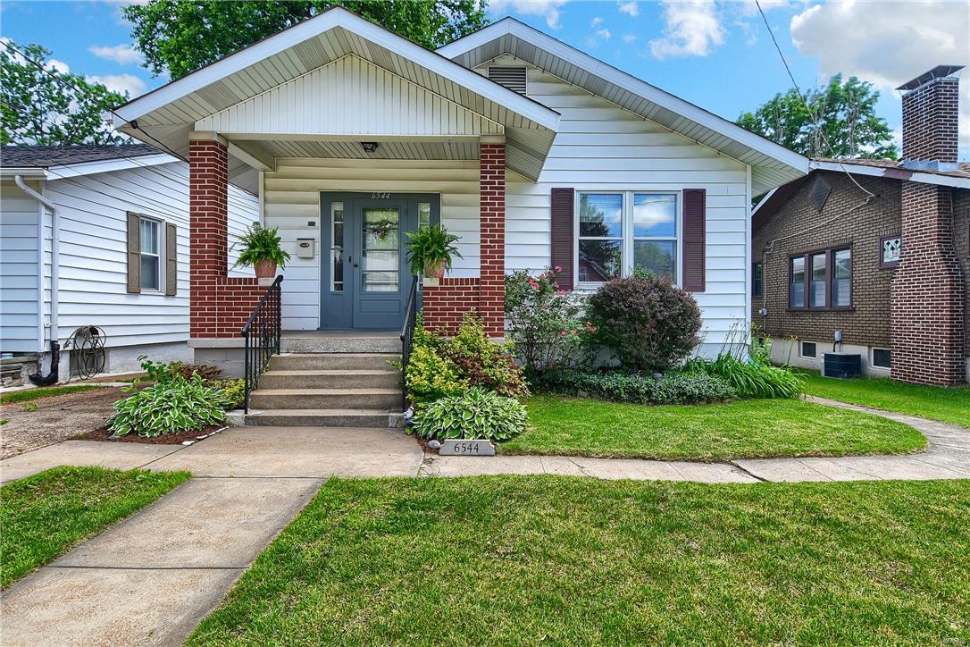 Great city home, excellent location and a great price!! 3 full bedrooms on the main floor! Living room and dining room are open and are used as a large family living space with faux fireplace, wood floors and plant shelf! Very bright and open! Eat in kitchen has oak cabinets and lots of charm! There is a family room that opens to a deck that overlooks the tropical yard with gazebo and brand new utility shed. Charming updated bath and good size bedrooms too! The lower level has a great rec room and additional 1/2 bath. Nice laundry area and lots of storage!! So much house for your $$$. Come see for yourself!