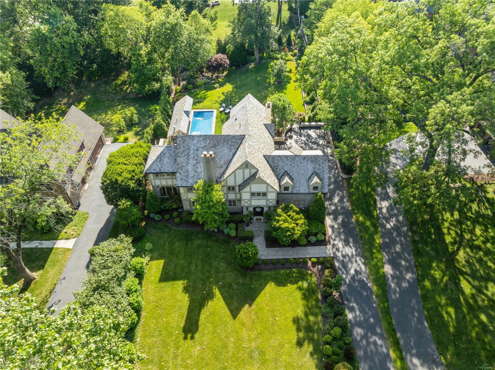 Experience style and elegance in this spectacular Tudor-style home in the coveted Fair Oaks neighborhood. A redesigned entry leads to a spacious foyer w 2 coat closets, terrazo flooring and grand living rm featuring elegant crown molding and fireplace. The garden rm provides panoramic views of the pool, cabana and lush gardens. Enjoy intimate dining by a bay window or the gourmet kitchen w large island, high-end appliances, kegerator. Walk in pantry! Family rm features custom built ins, beamed ceiling and grand fireplace. Upstairs, 4 beds each offer private en suites. Primary suite incl. dual dressing ROOMS, luxurious bath w soaking tub and steam shower. 2nd floor features include laundry, vaulted ceiling, balcony. Finished LL w 2 offices w tons of storage/cedar closet. Plus private neighborhood security, outdoor fireplace and patios. Custom designer finishes thru out. This exquisite home offers harmonious entertainment spaces, which seamlessly integrate indoor and outdoor area. Additional Rooms: Sun Room