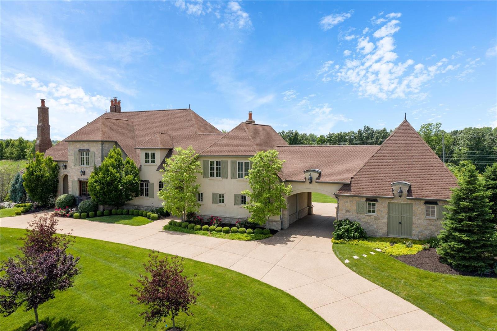 Spectacular custom built home w/amazing exterior & interior features like hand hewn beams,high ceilings,mill work,distressed wood fls,plaster walls & multiple entertaining areas that exemplify the consistent high quality throughout! The gourmet kitchen has custom cabintry,walk-in pantry,granite counters,hammered copper sinks,high-end appliances, Wolf gas stove,Sub-Zero frig,2 Asko dishwashers & refrigerator drawers.Main fl wine cellar too! The main fl master has coffered ceiling, gas fireplace & overlooks the pool.The luxurious master bath w/ "his" & "her" custom closets,expansive double vanities,jet tub,rain shower w/ multiple heads. Upstairs there are 5 additional beds,4 full baths,2nd floor laundry & loft.The outstanding walkout LL offers a rec rm w/firplace,Sub-Zero drawers,keg,& ice maker!Plus there is a game rm,2 full baths(one w/ steam shower),wk out rm & office.Situated on over 3 acres, extensivly landscaped,fire pit & private w/a Baker saltwater pool & multiple water features. Additional Rooms: Mud Room, Wine Cellar