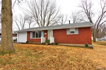 Updated kitchen with custom cabinets, stainless steel appliances, and solid surface counters. Eat in area with additional seating area in kitchen and large pantry. Two updated full baths on main level. Third bedroom has a washer and dryer hook up and a large walk in closet and bath. Nice yard and a super location.