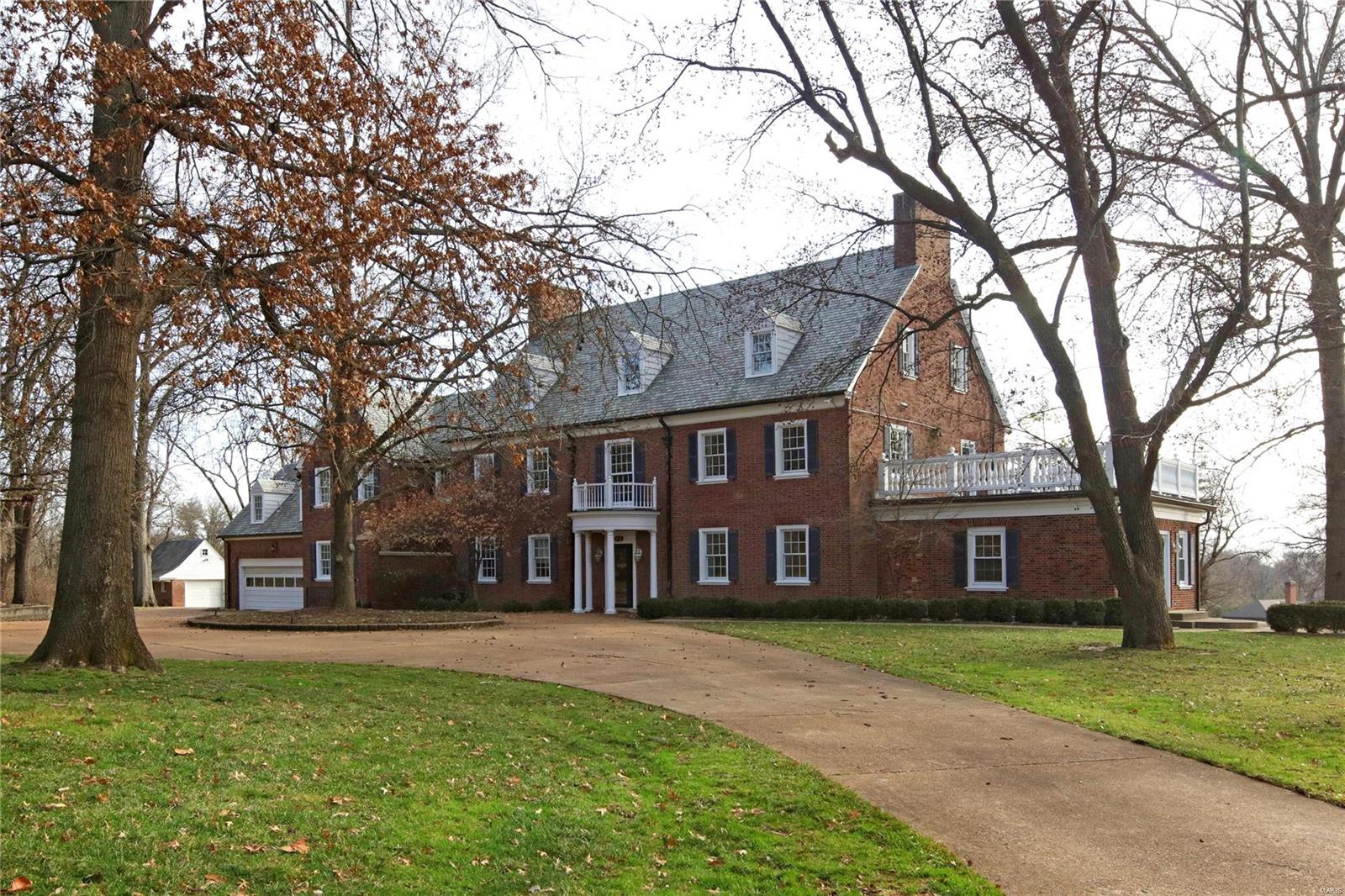 Fantastic opportunity in Ladue! Estate home on 4.12 acres w/ 7,307 sq ft, 8 bedrooms, 5.5 baths, & full southern exposure. Classic center hall design, 9' 7" ceilings, period millwork, running plaster molding, Pella replacement windows, original hardwood floors in great condition, updated electric, heated attached & single detached garage. Spacious living & dining rooms, breakfast room, butler's pantry, center island kitchen, main floor laundry, 5 fireplaces. Master suite & nursery combined/renovated could allow nice sized en suite bath & 13' x 16' dressing room. 3rd floor is a full story w/ 3 of the bedrooms, & spacious bath. LL w/ original rathskeller w/ 8' 6" ceilings & wood burning fireplace - needs renovation. Carriage house apartment w/ 2 rooms, 1 bath. Elevator services garage, 1st floor, apartment, & 2nd floor. Property being sold "As-Is".

Turn this 1929 beauty on 4.12 acres into a 2020 stunner or build your dream home on the park-like, private lot. Additional Rooms: Sun Room
