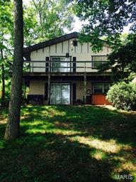 House is being SOLD AS IS.  Great opportunity to purchase lake front home at Lake Tishomingo!  House includes 50 feet of prime main lake frontage.  Wrap around deck, hot tub and private dock for your enjoyment.  Home has 2 car oversized attached garage, workshop/ utility area, 2 kitchens and 2 full baths.  Just waiting for a bit of TLC!