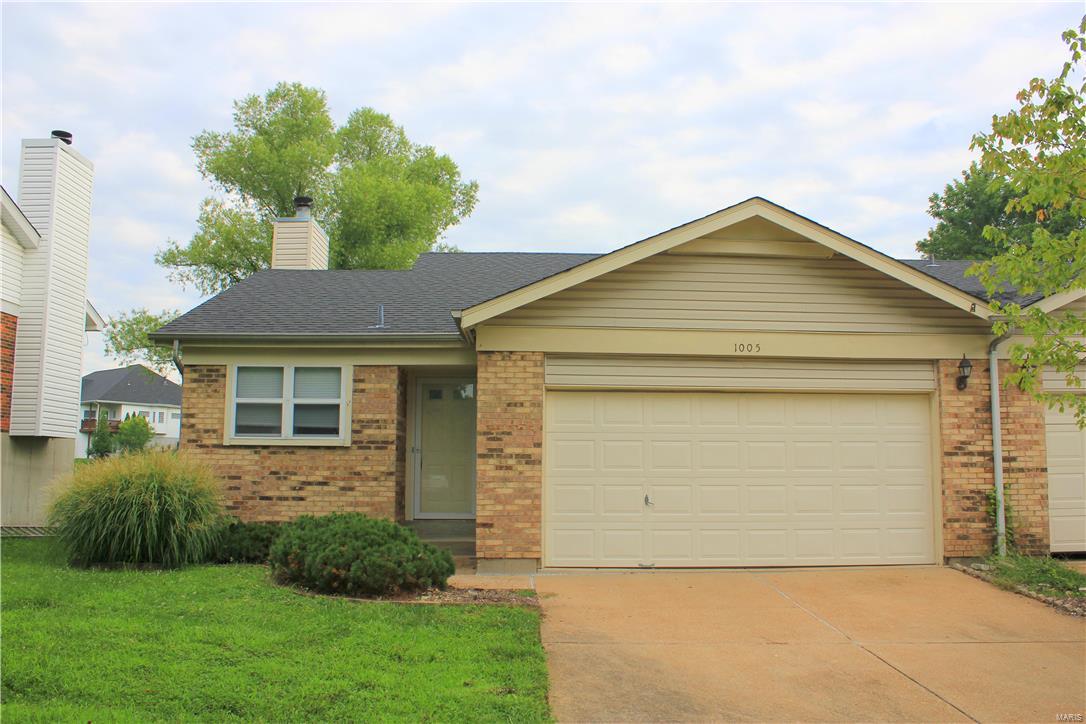 2 bedroom/2 bath attached home with 2 car garage located in the beautiful Woodhill neighborhood surrounded by Bluebird Park.  Spacious living area with vaulted ceilings, fireplace, and deck that backs to a large area of common ground. Kitchen features Smooth-top range, built-in microwave, dishwasher, and refrigerator. Full basement with washer/dryer hookups. Rockwood School District. Pet-friendly with a one-time non-refundable pet fee of $200 per pet. Security Deposit equal to one month's rent. Tenant responsible for all utilities- electric, water, trash, and sewer.