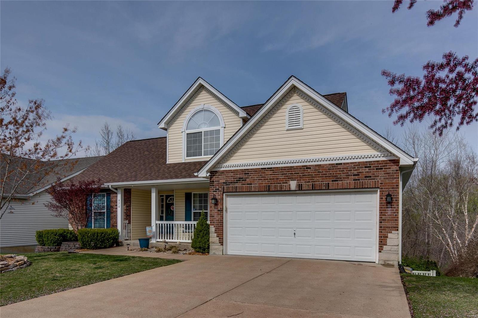 Fabulous 1.5 story updated home in the desirable Winter Lake Estates!  Offering 4 BR/3.5 BA & 2 Car Garage! The covered front porch welcomes you into the open floor plan & leads you into the amazing 2 story great room boasting wood floors & loads of natural light! The eat-in kitchen is open to the great room with quartz countertops, stainless steel appliances, beautiful cabinets & pantry! The Main Floor Master Suite features crown molding, walk in closet, luxury bathroom w/double sinks, linen closet & walk in shower. A separate dining room and main floor laundry complete the main level! The upper level features 2 bedrooms and a full bathroom! The walk out LL adds additional space with a family/rec room, gas fireplace, bedroom, full bath, & loads of storage space! Off of the kitchen walk out to the incredible deck & fenced yard (2021 $40K+) and enjoy the views backing to trees! Convenient to Gravois Bluffs, Hwys & much more!