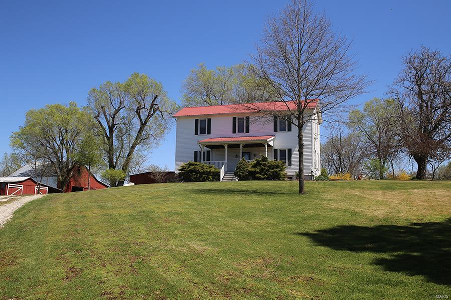 SUPER GREAT NEW PRICE! *** SCENIC VIEWS! *** TOTALLY RENOVATED 1800’S FARMHOUSE! *** Come see & appreciate this peaceful living and all you find in this package....Wonderful spacious cook’s delight kitchen, exposed log wall in separate dining room, beautiful wood flooring in most rooms with graceful living room setting of built in cabinets & fireplace. Upper level you will find all large bedrooms and your laundry room w/brand new washer & dryer which stays! & another bath. Must check out the views while swinging on your large covered front porch or sitting on the wraparound sun porch in back, stroll out to the barns or down to the stocked pond where you can relax and fish for the big ones. Also must mention the 19.9 acres of mixture of wooded wonderland with small runoff creek and also some open for some animals. 2 car covered parking & attached gas grill is hooked up to tank so will stay as well! **** Call today, don’t miss out! ***