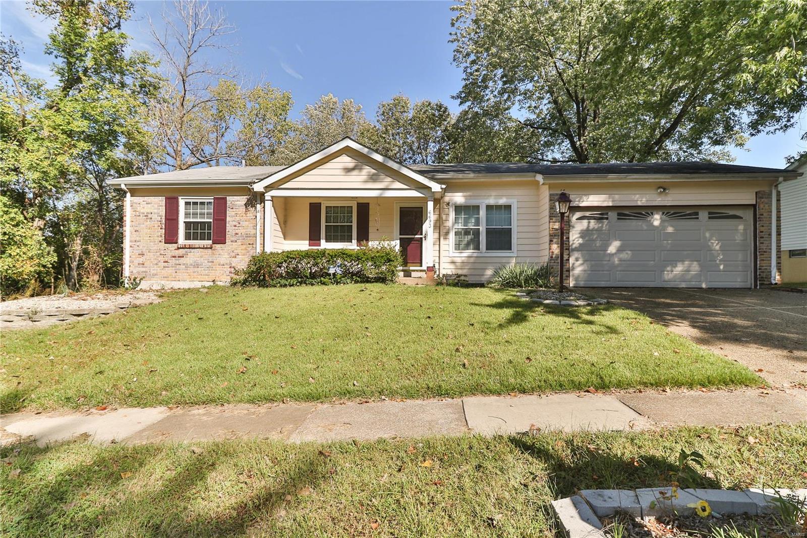 Find comfort and charm in this Florissant Foxwood ranch! Enter into the comfortably sized Living Room filled with natural light. Travel on hardwood floors into open area, perfect for a cozy Family Room or Dining area with wood burning fireplace. Opens into generously sized Kitchen with center island, updated appliances, and tile backsplash. Down the hall, you’ll find the Master Suite and two additional bedrooms, 1 of which can easily be turned into a home office, den, or playroom. The walk-out Basement with additional bedroom has plush carpet and is perfect for entertaining, storage, or play! Enjoy newly installed, energy efficient insulated windows throughout the home. Around back, you’ll find a sizeable, partially fenced-in yard with elevated patio space. Nicely situated at the end of a friendly cul-de-sac.