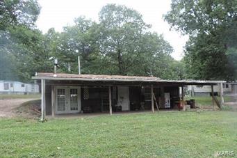 6.2 +/- acres suitable for horses or hunting. Property offers a 2 bedroom earth home with open living room and spacious kitchen. Enjoy the abundance of wildlife and privacy while relaxing on your covered front porch and watching all the wildlife roam. Enjoy the secluded scenery with plentiful trees and your own private driveway. Schedule an appointment to see this great property today. SpecialListingConditions: Foreclosure