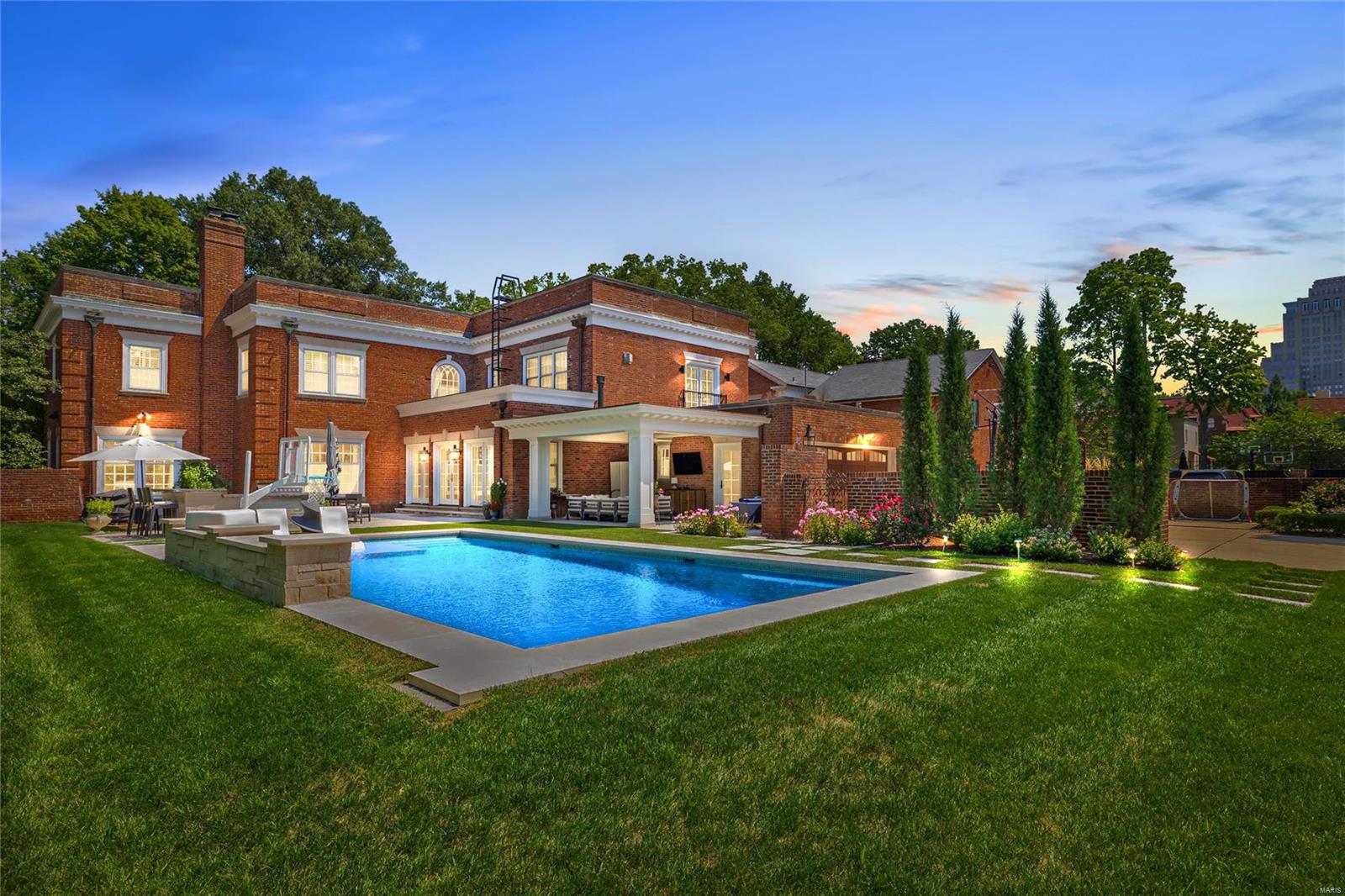 Beautifully situated on a premier historic street adjacent to Forest Park, this exceptional residence has been extensively updated and enlarged with a seamless two-story addition that includes a spacious kitchen w/ adjacent family room, mud room, 2-car garage & a 2nd-floor primary suite which includes a luxurious spa/bathroom, sitting area, dressing room & an outside balcony.  Besides the primary suite, there are three additional second-floor bedrooms & bathrooms and a sitting room. The sophisticated interior features outstanding architectural detail including gleaming herringbone-pattern hardwood floors, original millwork, a gracious entry staircase,  crown molding, wainscoting, arched doorways, living room fireplace, & a paneled library. French doors in the family room lead to a rear garden area that features a saltwater pool, pavilion, built-in grill & fridge, and a spacious patio, making this a perfect, entertaining oasis.  This home is the epitome of style, grace & sophistication. Additional Rooms: Mud Room