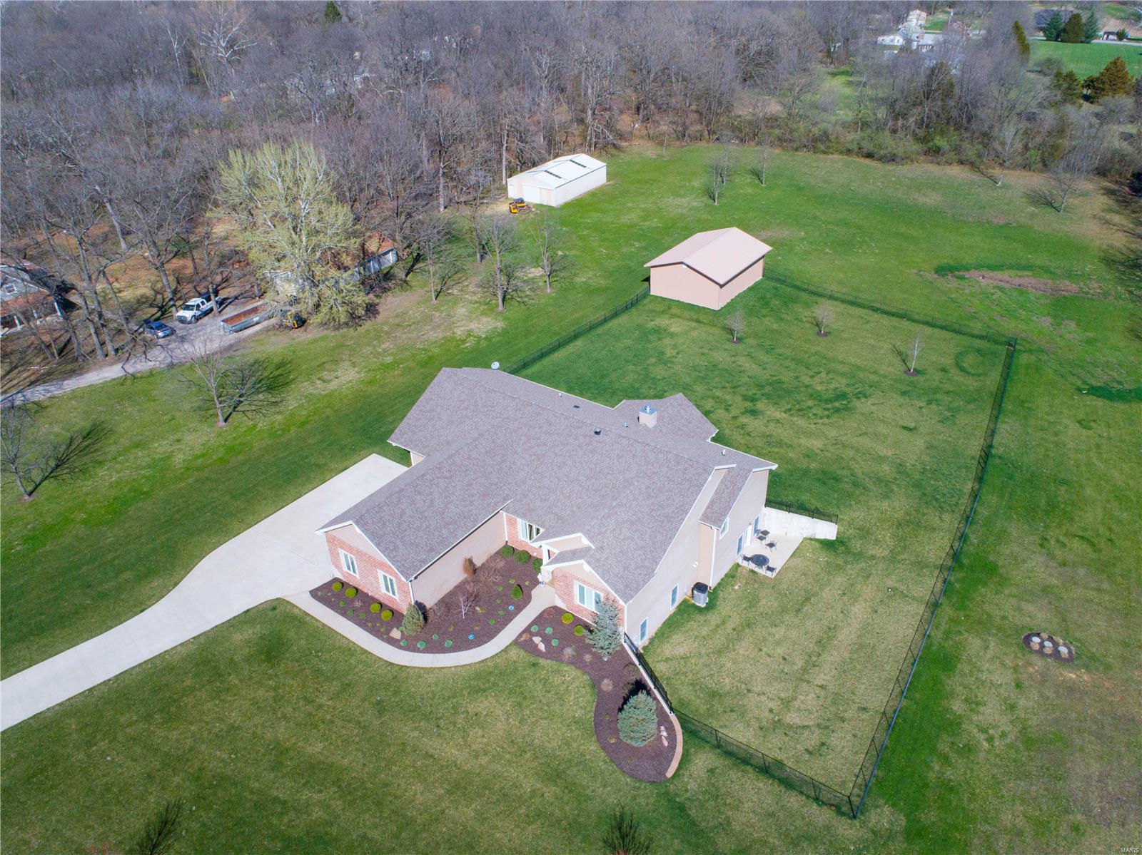 This beautiful 4 bedroom, 3.5 bath, custom built, sprawling ranch is the home you have been waiting for. Gorgeous vaulted ceilings in the great rm & hearth connected by a see thru fireplace that flows into the top of the line kitchen. Truly a chef's dream kitchen featuring Monogram GE stainless appliances including 6 burner+griddle gas range w/hood, convection microwave dishwsher & built in refrigerator, cust softclose cabinets, quartz counter, island & walkin pantry. Take your pick at 1 of 2 main floor master suites. There is no wrong choice as both feature custom walkin closets, dual sinks w/quartz counters, walkin showers & coffered ceilings. Finished walkout LL could be used as additional living quarters w/2 bdrms, kitchenette/laundry, wetbar & recrm. 3car attached oversize garage &outbuilding 40x30. Level fenced yard is perfect for HORSES kids, pets, or just to enjoy the beautiful scenery. Tucked away on Forst Drive you get the feel of the county but still close to all amenities.