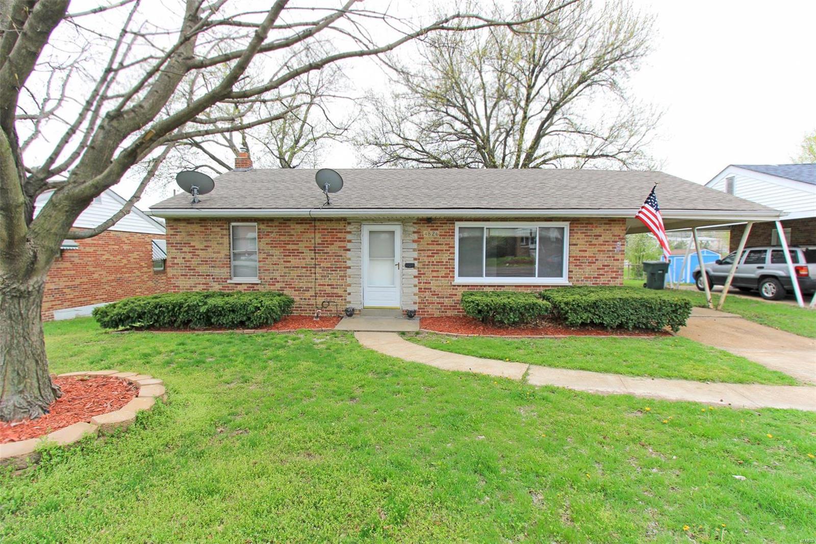 Nice all brick ranch home for under 100k.  Large level yard, along with a carport to keep weather off of your vehicle.  There is also a utility shed to store your lawn equipment and tools. Inside has fresh paint and new flooring in this well priced home.  2 bedrooms and a full bath on the main level.  The lower level has a couple of finished rooms to use for any extra needs, along with plenty of unfinished space for storage.  Come check it out today!