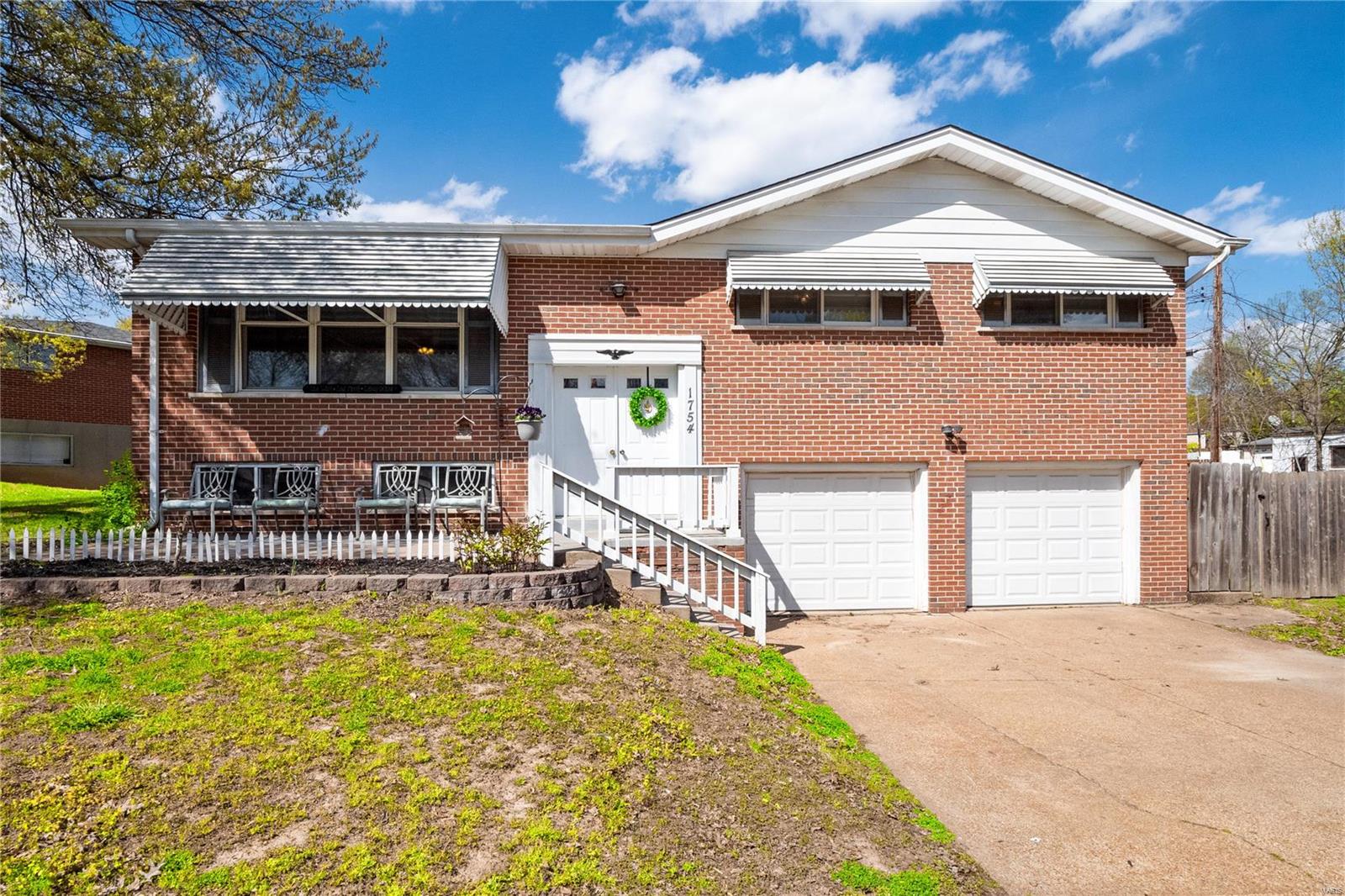 This brick home sits proudly on a fantastic corner .30 lot offering plenty of room for family gatherings or a game of soccer. The main level features open sun filled living room with large picture window, breakfast room and kitchen with peninsula bar. The inviting kitchen provides many maple cabinets and counter space for every kitchen gadget perfect for the avid baker or chef. Newly refinished hardwood floors flow from the main living areas into 3 bedrooms. Huge master suite (plenty of room for a king bed) with half bath, double closet. New laminate "wood looking" floors were just installed in the lower level rec room. This is a fantastic space to spread out as it provides a half bath and laundry. Two car oversized garage, new cordless blinds, updated lighting, freshly painted! Close to shopping and access to Highway 55 & 141. Welcome Home!
